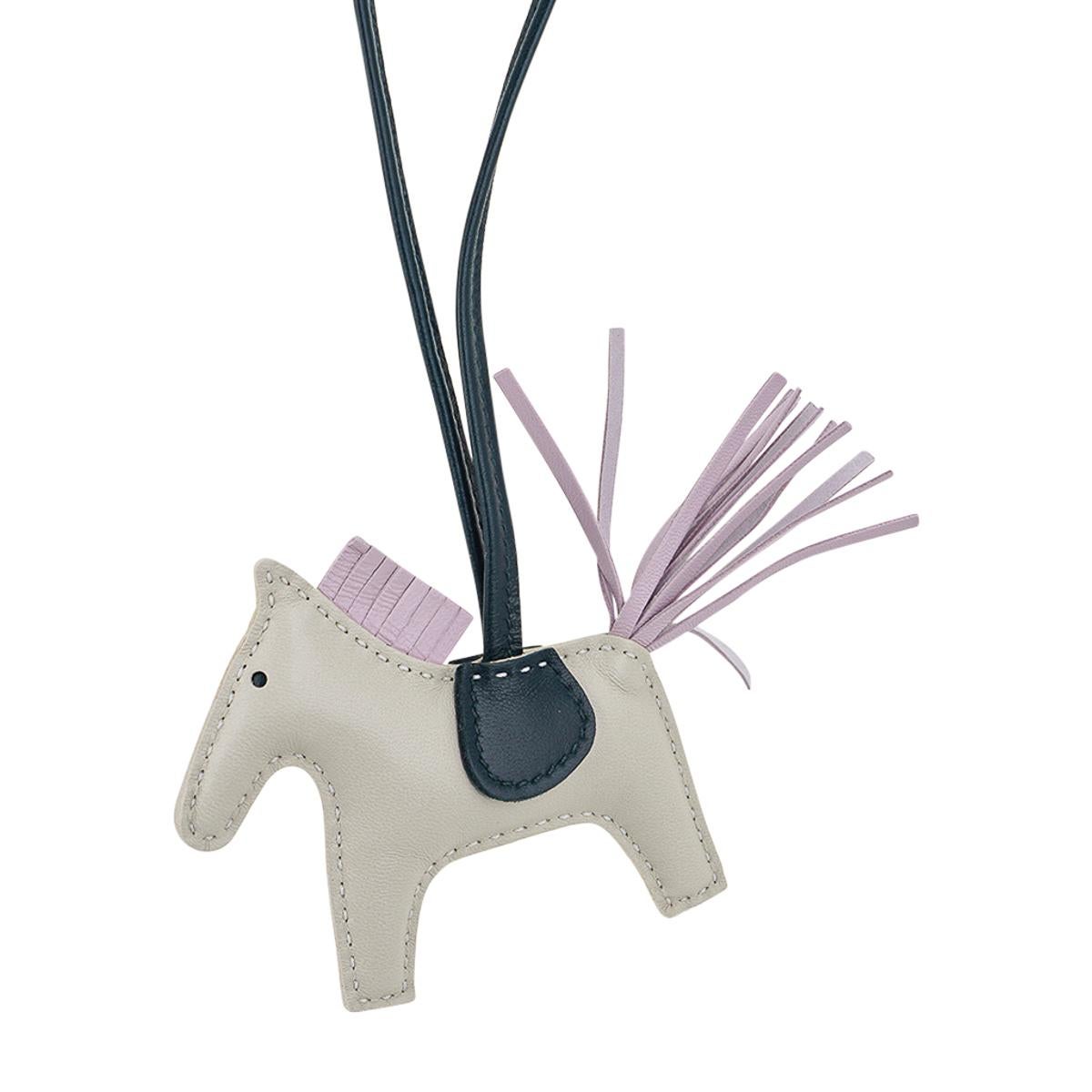 Mightychic offers an Hermes PM Rodeo bag charm featured in Craie, Mauve Pale and Vert Cypress.
Charming and playful she easily adorns a myriad bag colors in your fabulous collection. 
Skin is Milo lambskin.
Signature HERMES PARIS MADE IN FRANCE is
