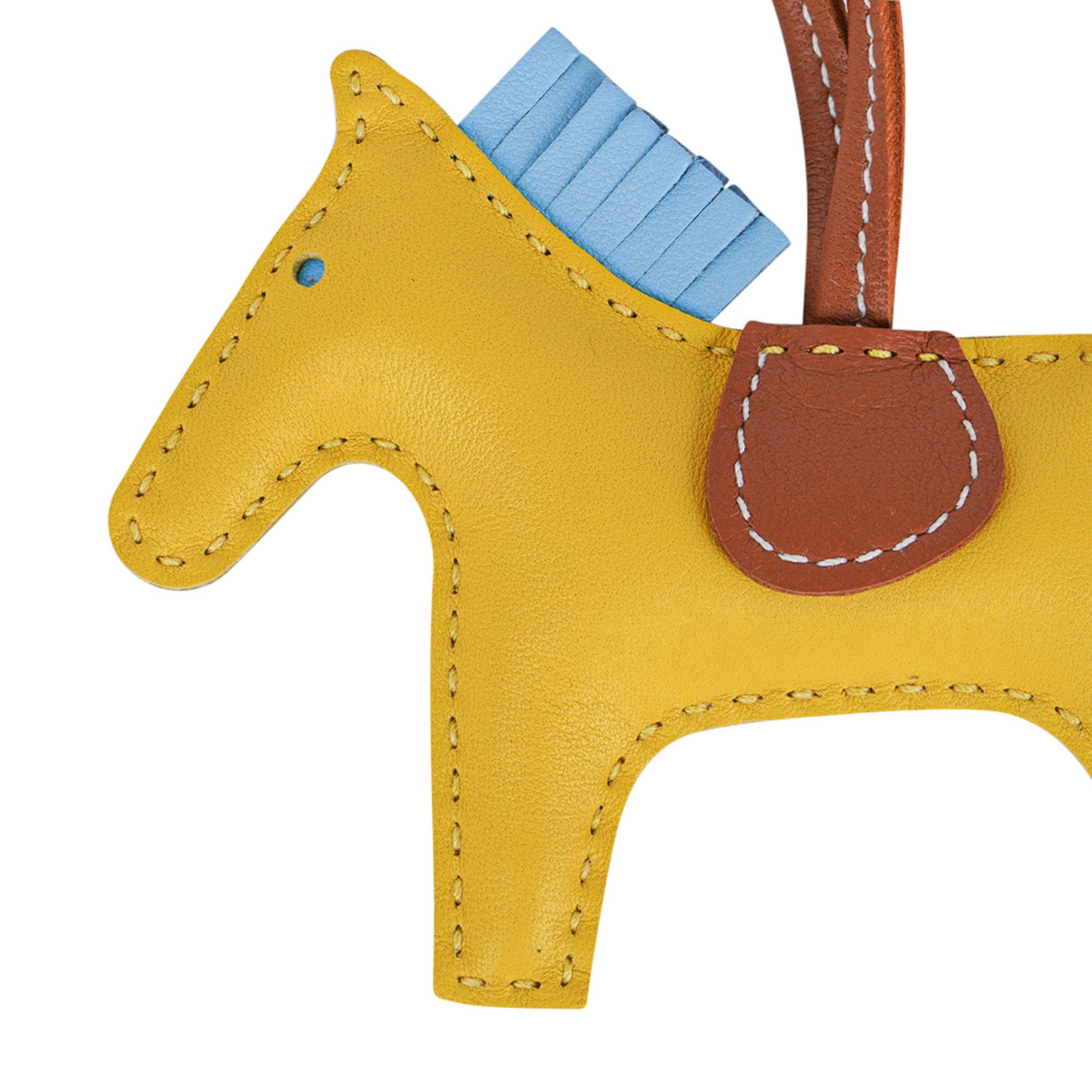 Mightychic offers a guaranteed authentic coveted Hermes PM Rodeo bag charm featured in Jaune de Naples, Blue Celeste and Gold.
Charming and playful she easily adorns a myriad bag colors in your fabulous collection. 
Skin is Milo lambskin.
Signature