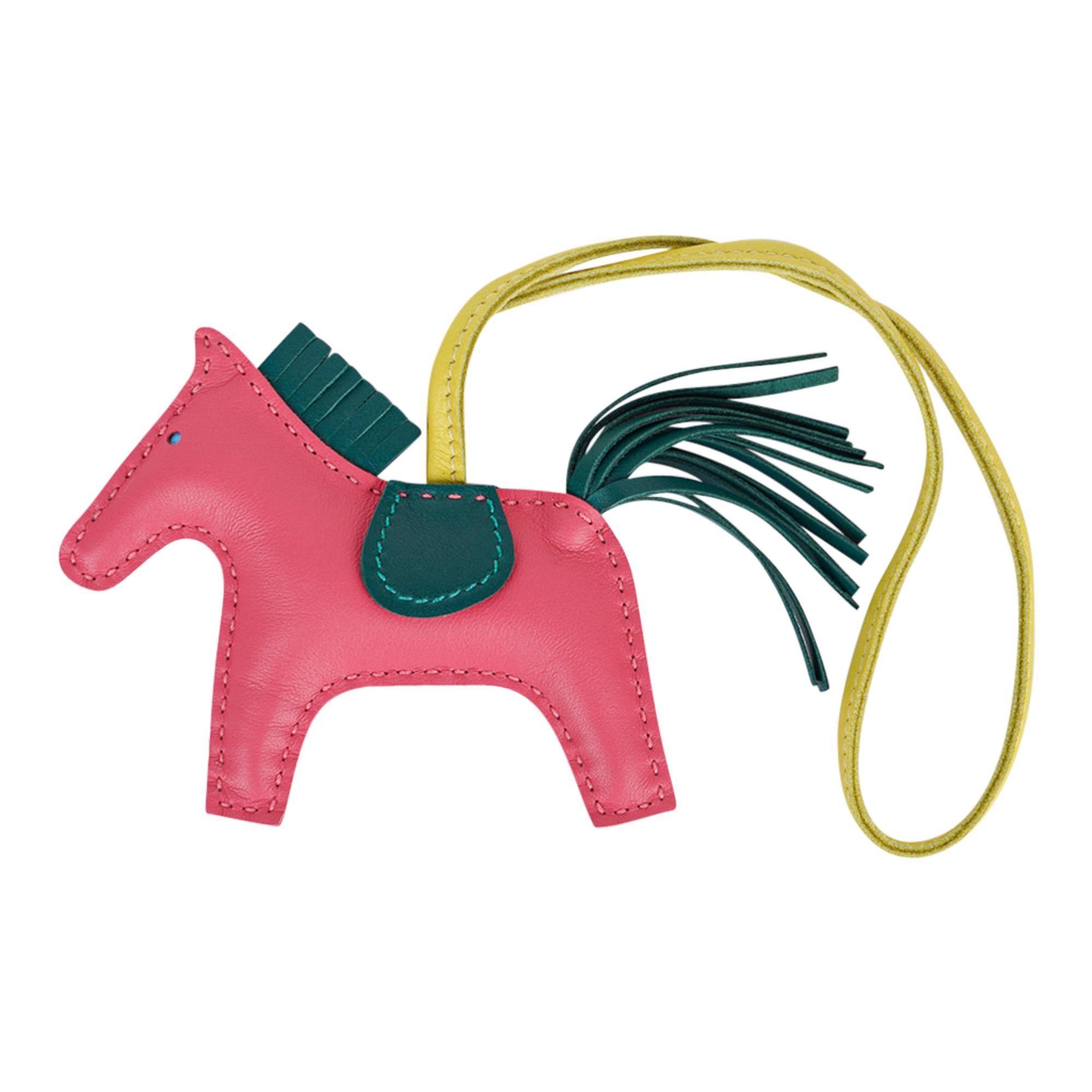 Mightychic offers an Hermes PM Rodeo bag charm featured in Rose Azalee, Malachite and Lime.
Charming and playful she easily adorns a myriad bag colors in your fabulous collection. 
Skin is Milo lambskin.
Signature HERMES PARIS MADE IN FRANCE is