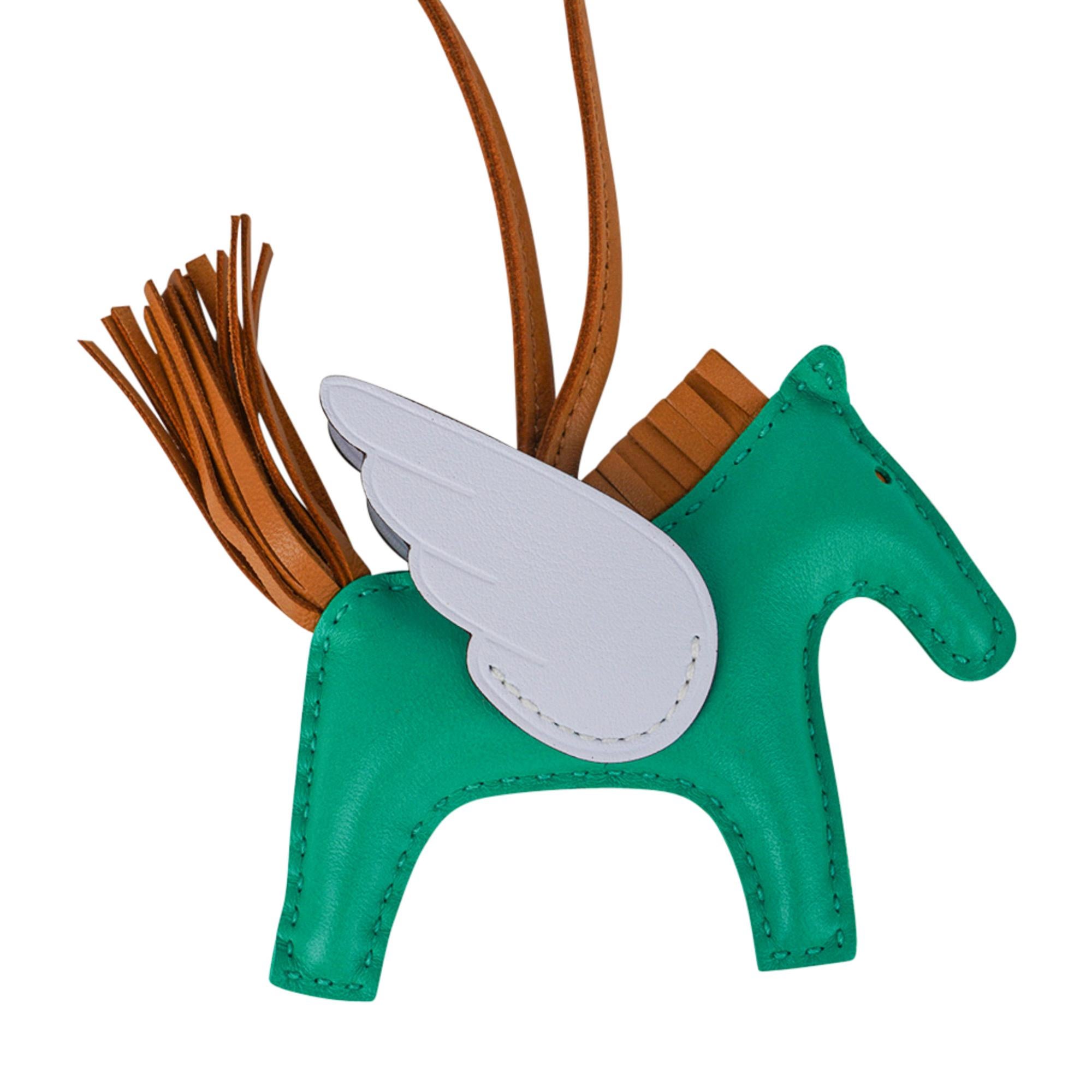 Mightychic offers an Hermes Pegase Rodeo PM bag charm featured in Menthe, Sesame and Bleu Brume.
Charming and playful she easily adorns a myriad bag colours in your fabulous collection. 
Skin is Milo lambskin.
Signature HERMES PARIS MADE IN FRANCE