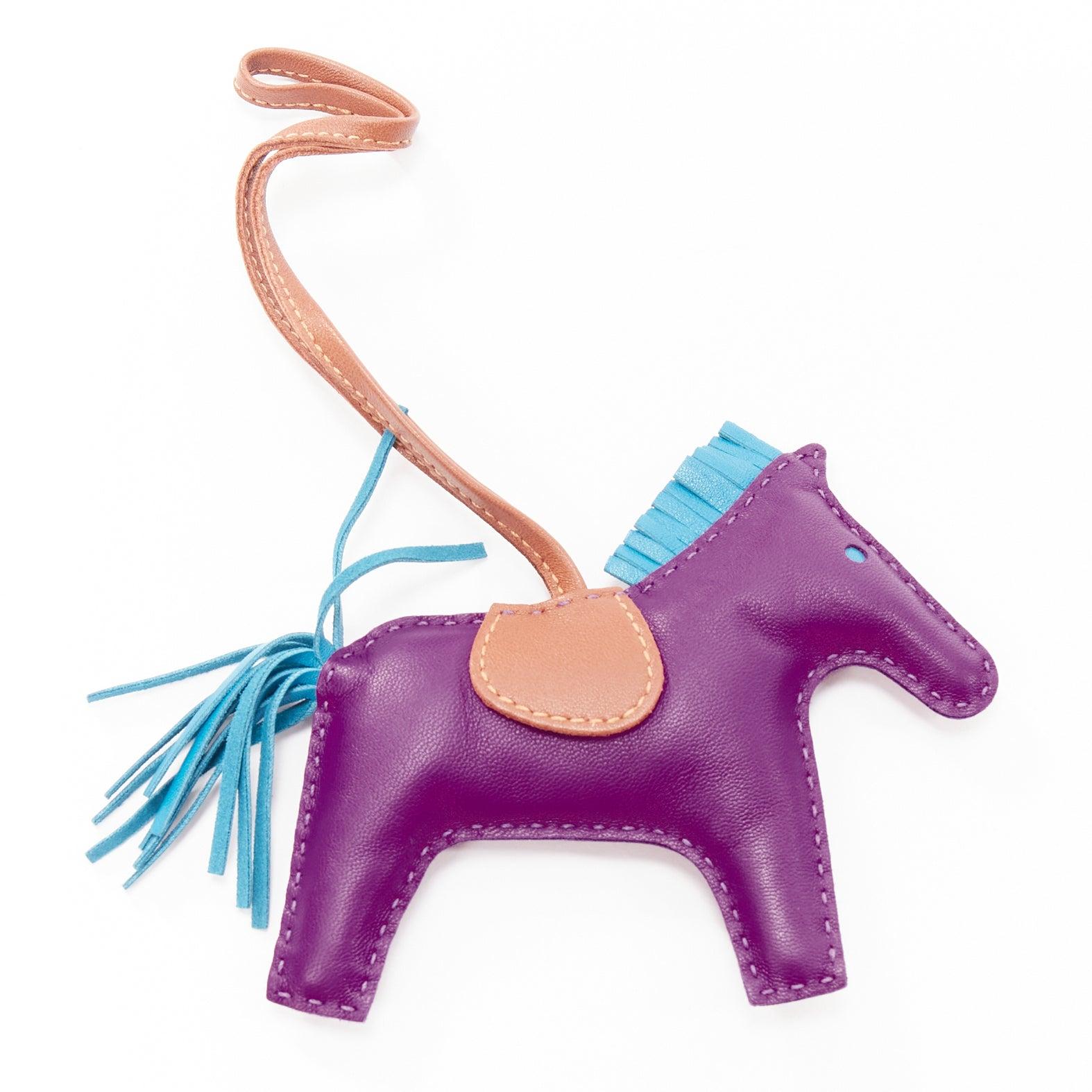 HERMES Rodeo PM purple leather brown trim fringed tail horse charm
Reference: AAWC/A01025
Brand: Hermes
Model: Rodeo PM
Material: Leather
Color: Purple, Brown
Pattern: Solid
Closure: Strap
Lining: Brown Leather
Made in: France

CONDITION:
Condition: