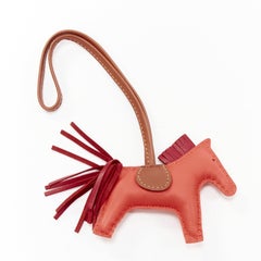 HERMES Rodeo PM red leather brown trim fringed tail horse bag charm