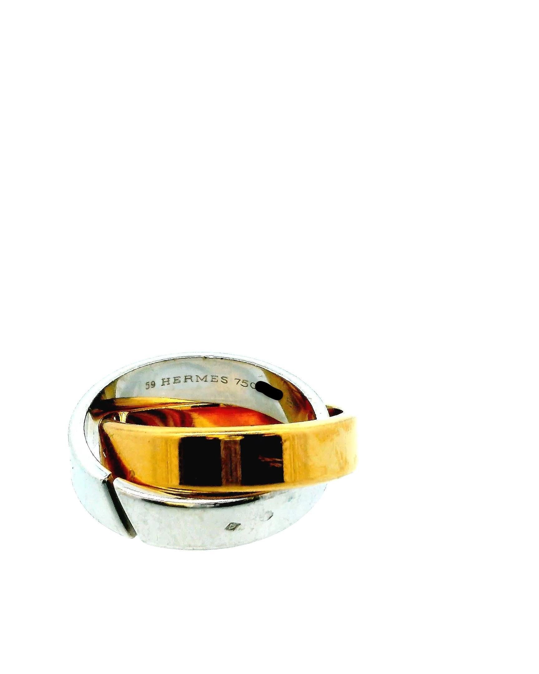 A sophisticated Hermès ring, crafted in France, featuring an elegant intertwining design of 18k White and Yellow Gold with Box.

Ring size 7.5
Total weight 17.0g