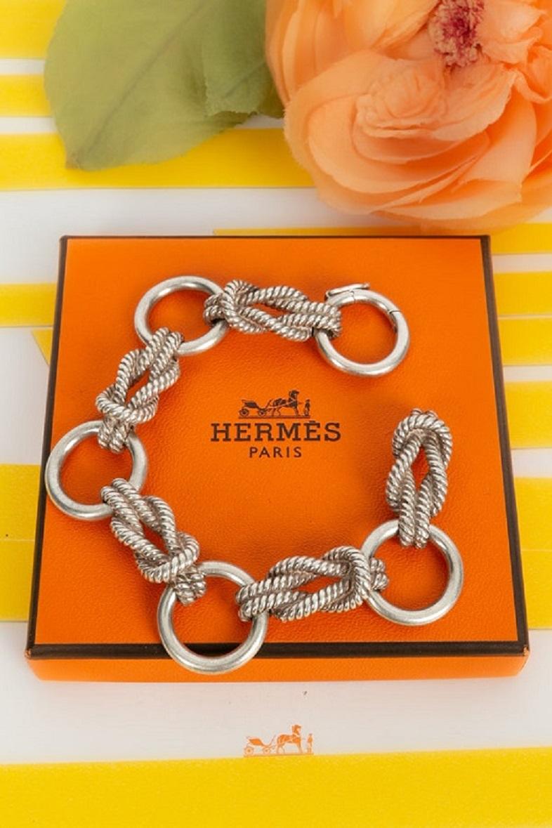 Hermes -Silver bracelet made of rings and marine knots with rope motifs.

Additional information:
Dimensions: Length: 18 cm 
Height: 2 cm
Condition: Very good condition
Seller Ref number: BRA161
