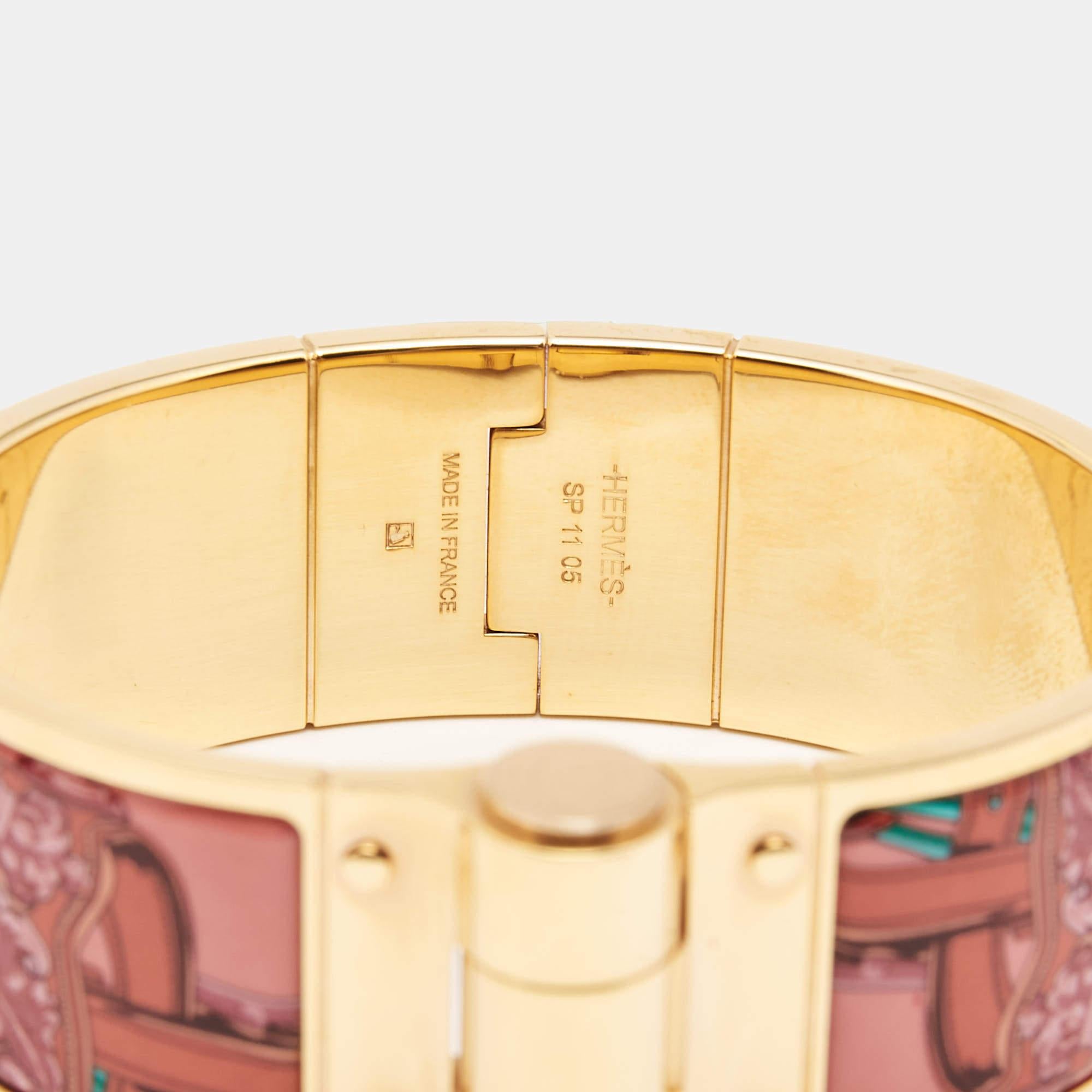 This elegant Brides de Gala bracelet from the house of Hermès is designed in a wide silhouette. It features a gold-plated body with appealing designs on it. Wear it with your favorite watch or as a solo piece.

Includes: Original Box, Original
