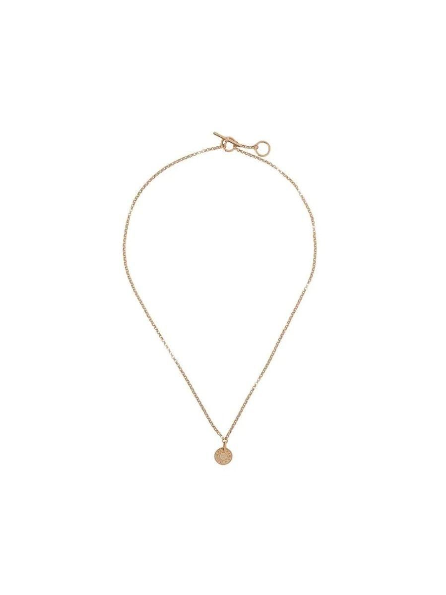 The epitome of luxury and delicacy comes in the form of this Hermès Rose Gold necklace set with a diamond. The necklace makes a gentle nod to the Hermès equestrian roots, featuring a pendant with 