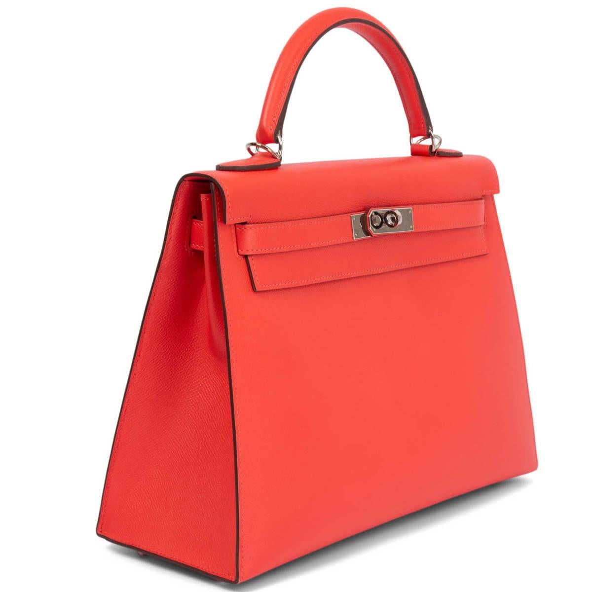 100% authentic Hermes Kelly II 32 Sellier bag in Rose Jaipur (coral pink) Veau Epsom leather with palladium hardware. Lined in Cherve (goat skin) with two open pockets against the front and a zipper pocket against the back. Has been carried with