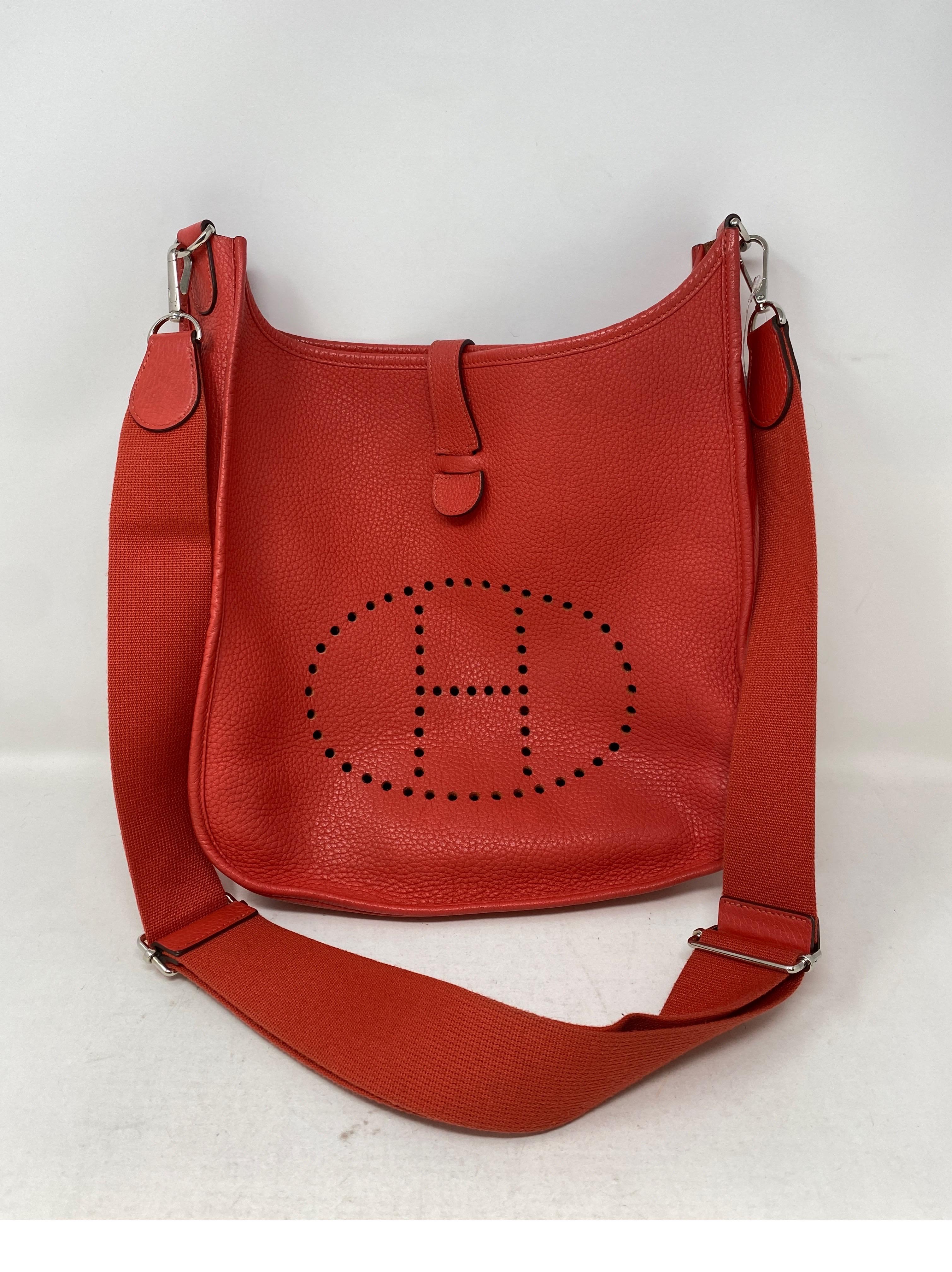 Hermes Rose Pivoine Evelyne GM Bag. Rosy salmon pink leather bag. Great crossbody or shoulder bag. Adjuastable strap. Bigger size. Good condition. Silver hardware. Guaranteed authentic. 