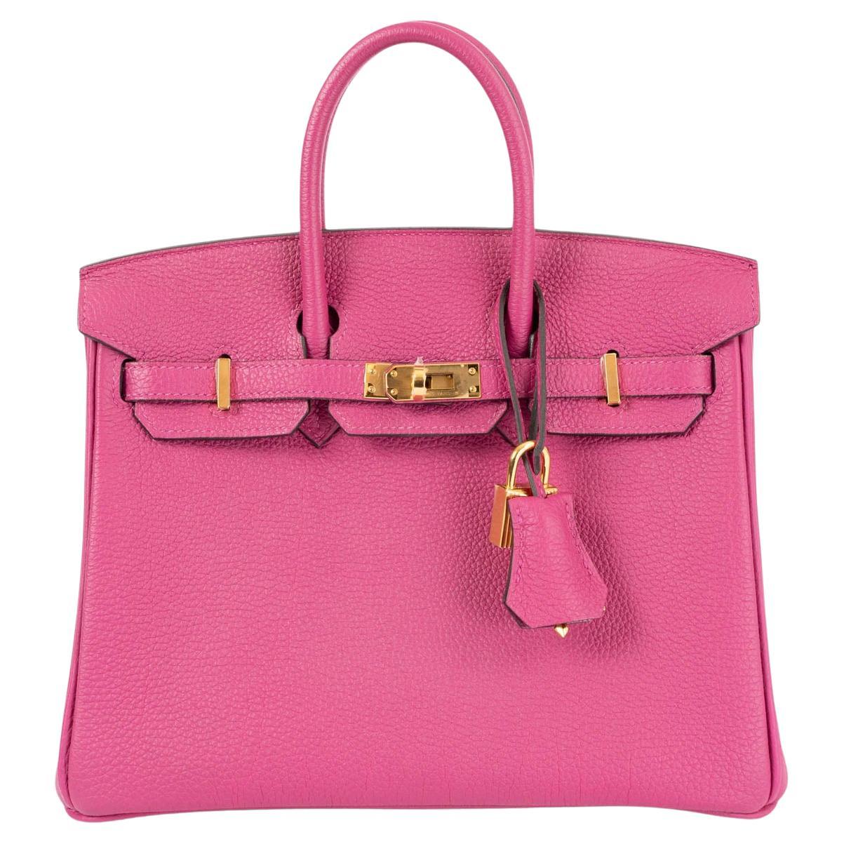 100% authentic Hermès Birkin 25 bag in Rose Pourpre (pink) Veau Togo leather with gold-plated hardware. Lined in Chevre (goat skin) with an open pocket against the front and zipper pocket against the back. Has been carried and is in virtually new
