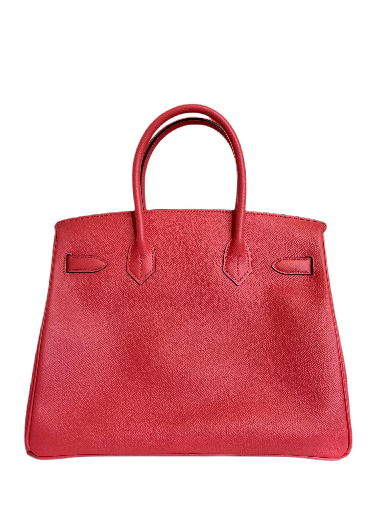 This authentic Hermès Rose Red 30 cm Epsom Birkin is pristine with the protective plastic intact on the hardware.  The elusive Birkin is made by hand and often requires extensive waitlists.  
Vibrant rose red has blue undertones and is perfectly