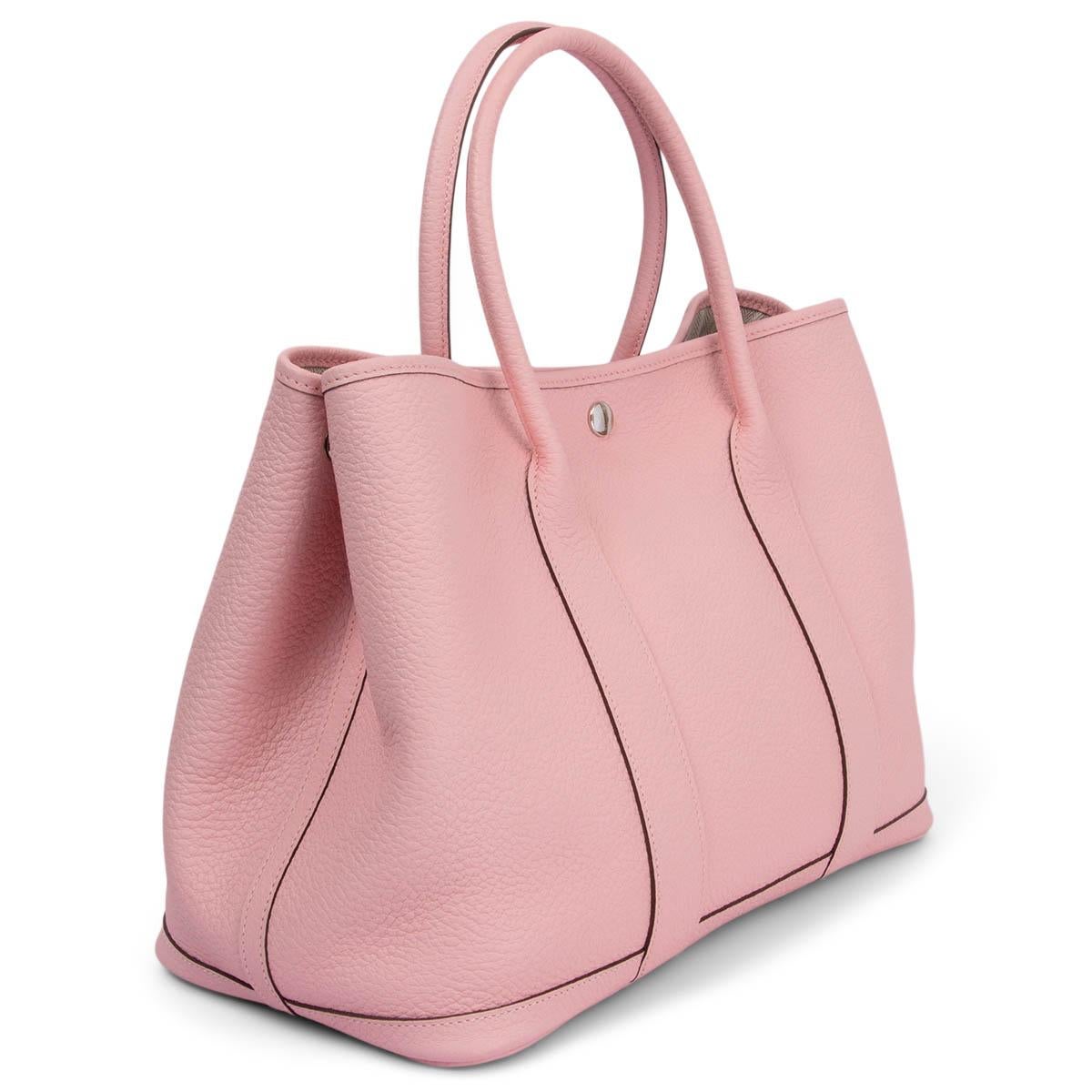 100% authentic Hermès Garden Party 36 in Rose Sakura pink Vache Country leather. Cloeses with a Palladium snap fastening and has two side press-stud fastening. Lined in off-white chevron canvas with an internal zip pocket. Brand new - comes with