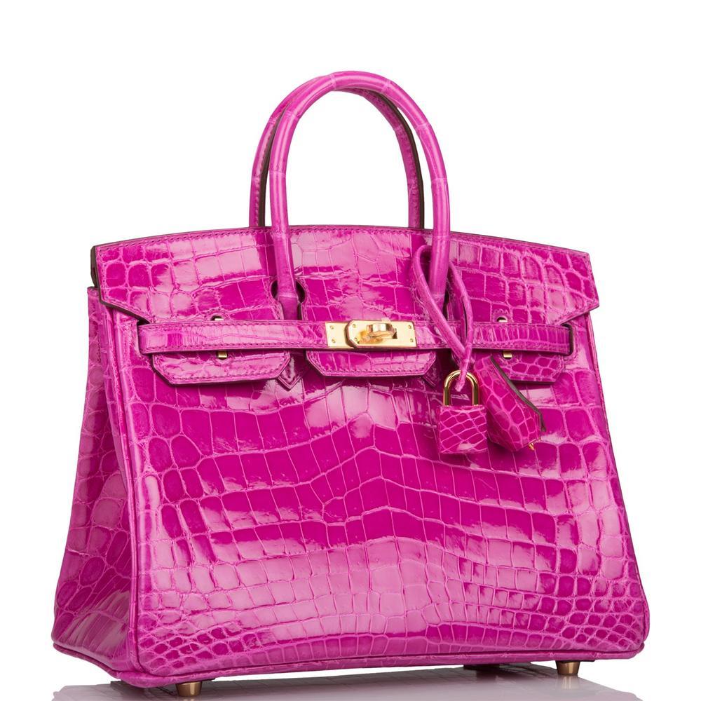 This Birkin is in Rose Scheherazade shiny Niloticus crocodile with gold hardware and has tonal stitching, a front toggle closure, a clochette with lock and two keys, and double rolled handles.

 

The interior is lined with Rose Scheherazade chevre