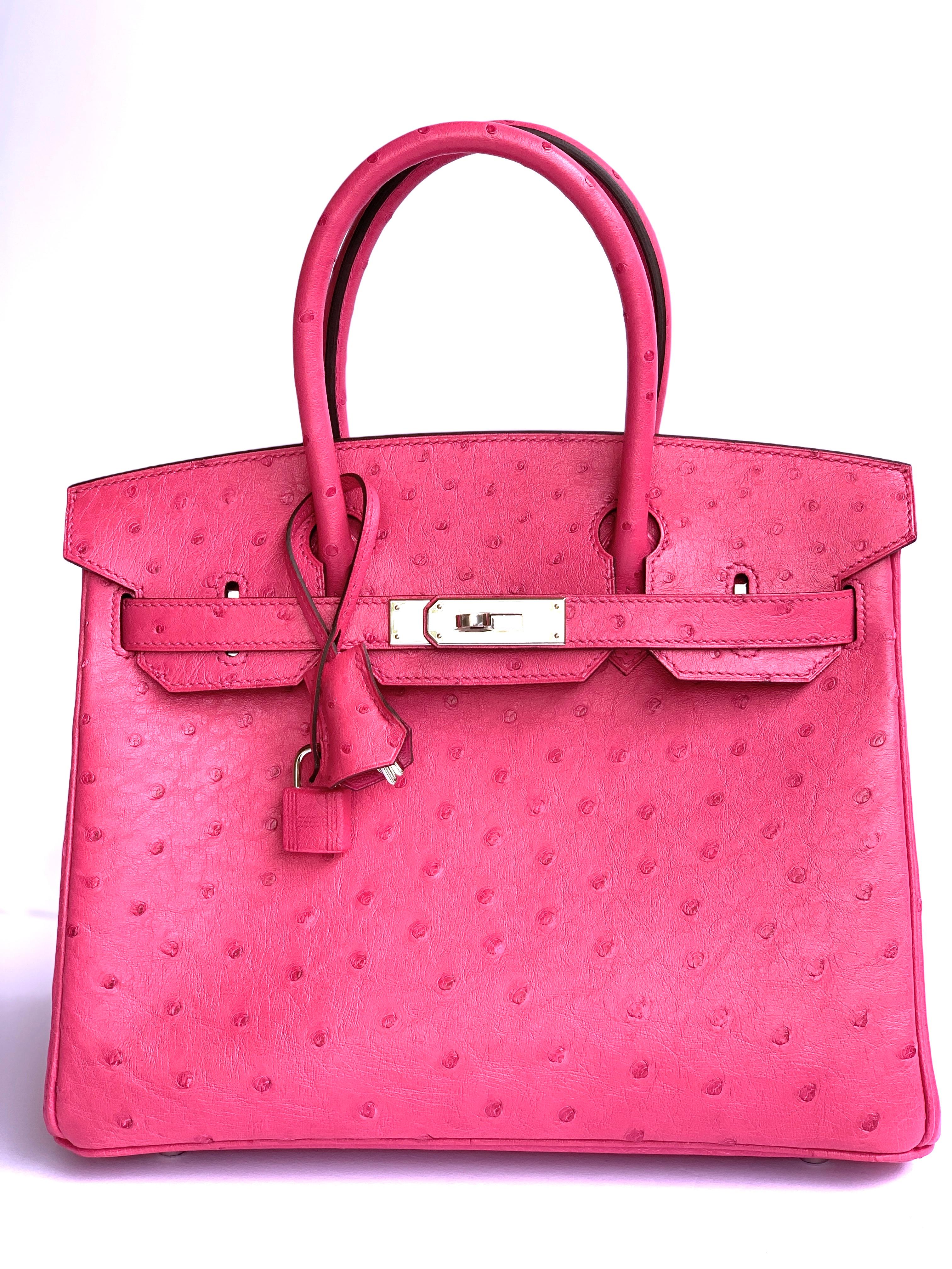 Hermes Rose Tyrien Birkin 30cm of Ostrich with palladium hardware.
Ostrich is durable and holds it shape on the Birkin, which is why collectors
love it so much.
If you like pink , this is one of Hermes best selling pinks of all time, Rose