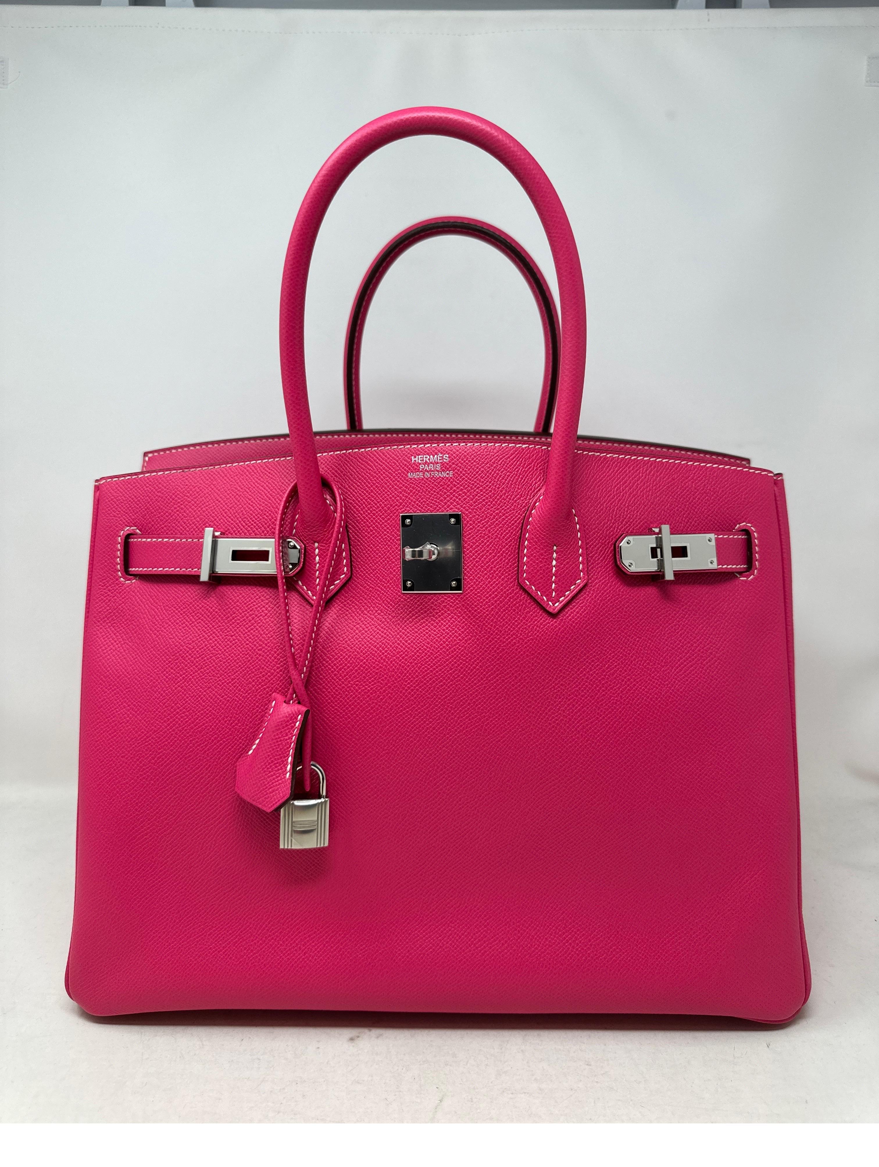 Hermes Rose Tyrien Birkin 35 Bag. Excellent condition. Palladium silver hardware. Excellent condition. Looks like new. Plastic is still on hardware. Interior clean. Includes clochette, lock, keys, and dust bag. Guaranteed authentic. 