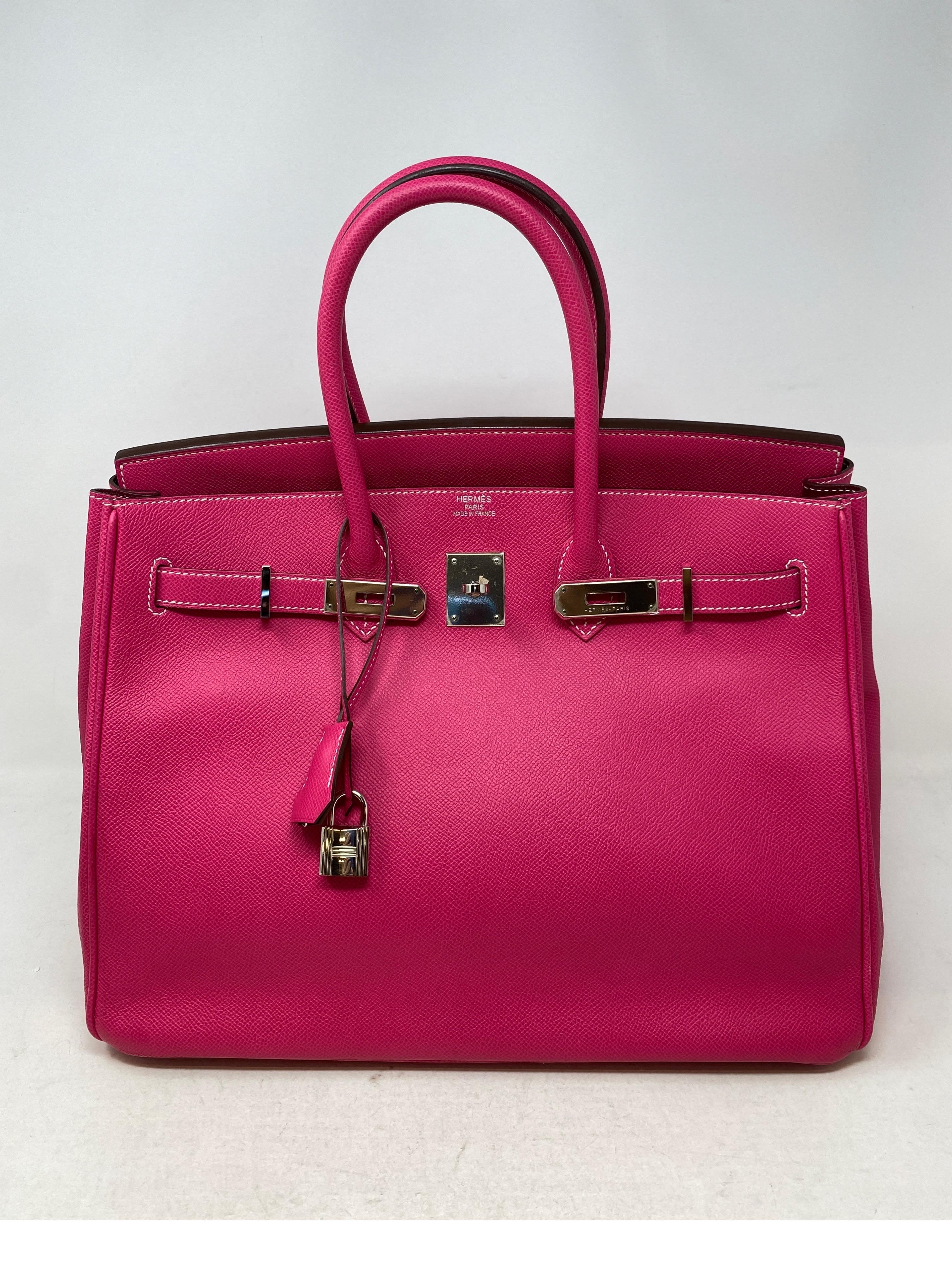 Hermes Rose Tyrien Birkin 35. Candy bi-color with rouge red interior. Beautiful dark hot pink color with palladium hardware. Good condition. Includes clochette, lock, keys, and dust cover. Guaranteed authentic. 