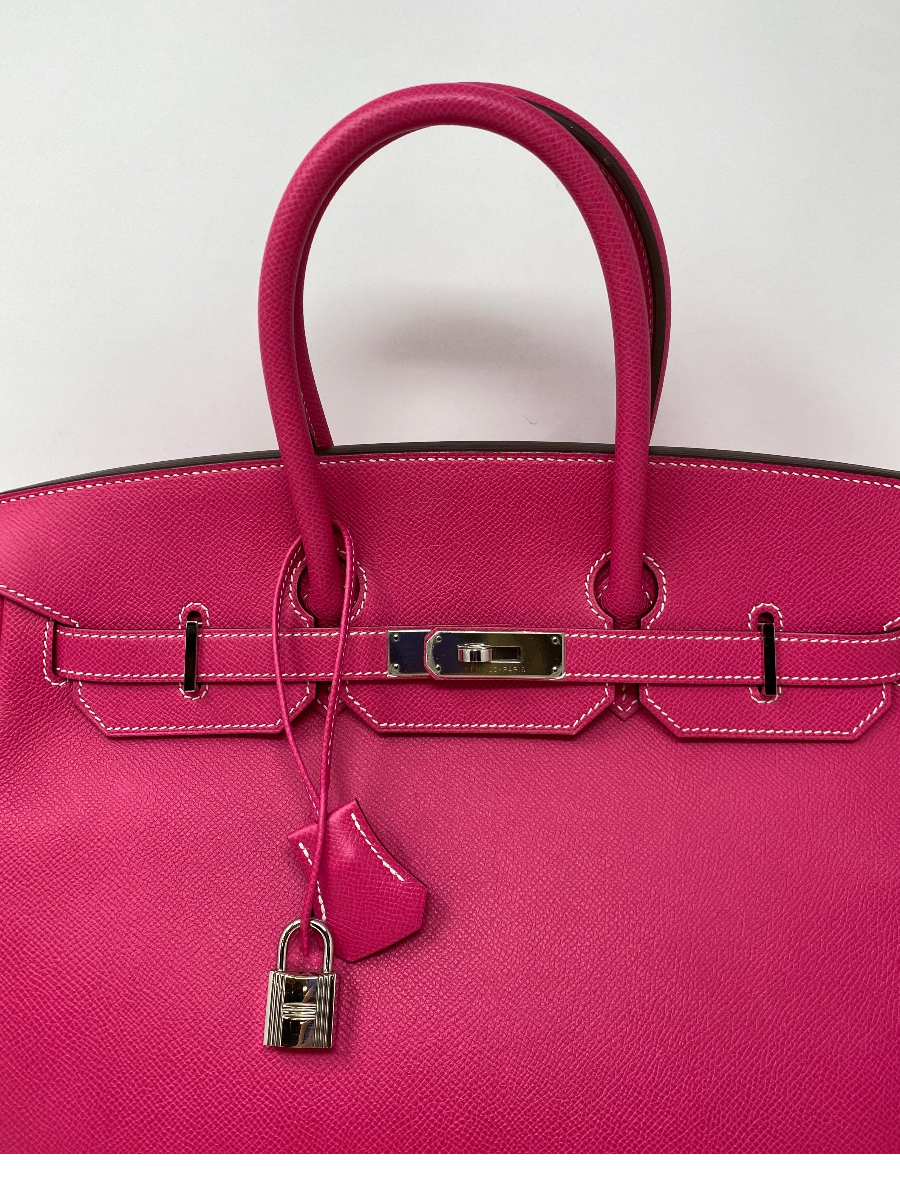 Hermes Rose Tyrien Candy Birkin 35 Bag. Hot pink color with silver palladium hardware. Candy limited with rouge red interior. Excellent condition. Plastic still on hardware. Fun bright color. Includes clochette, lock, keys, and dust bag. Guaranteed
