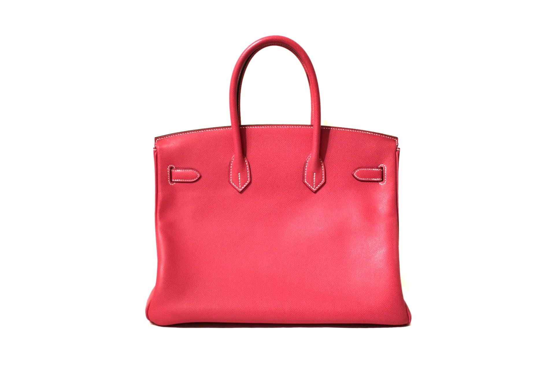 This authentic Hermès Rose Tyrien Epsom 35 cm Birkin is in excellent plus condition.    Considered the ultimate luxury item, the Hermès Birkin is stitched by hand.  Waitlists are commonplace.   Rose Tyrien is a vivid pink pop color for any