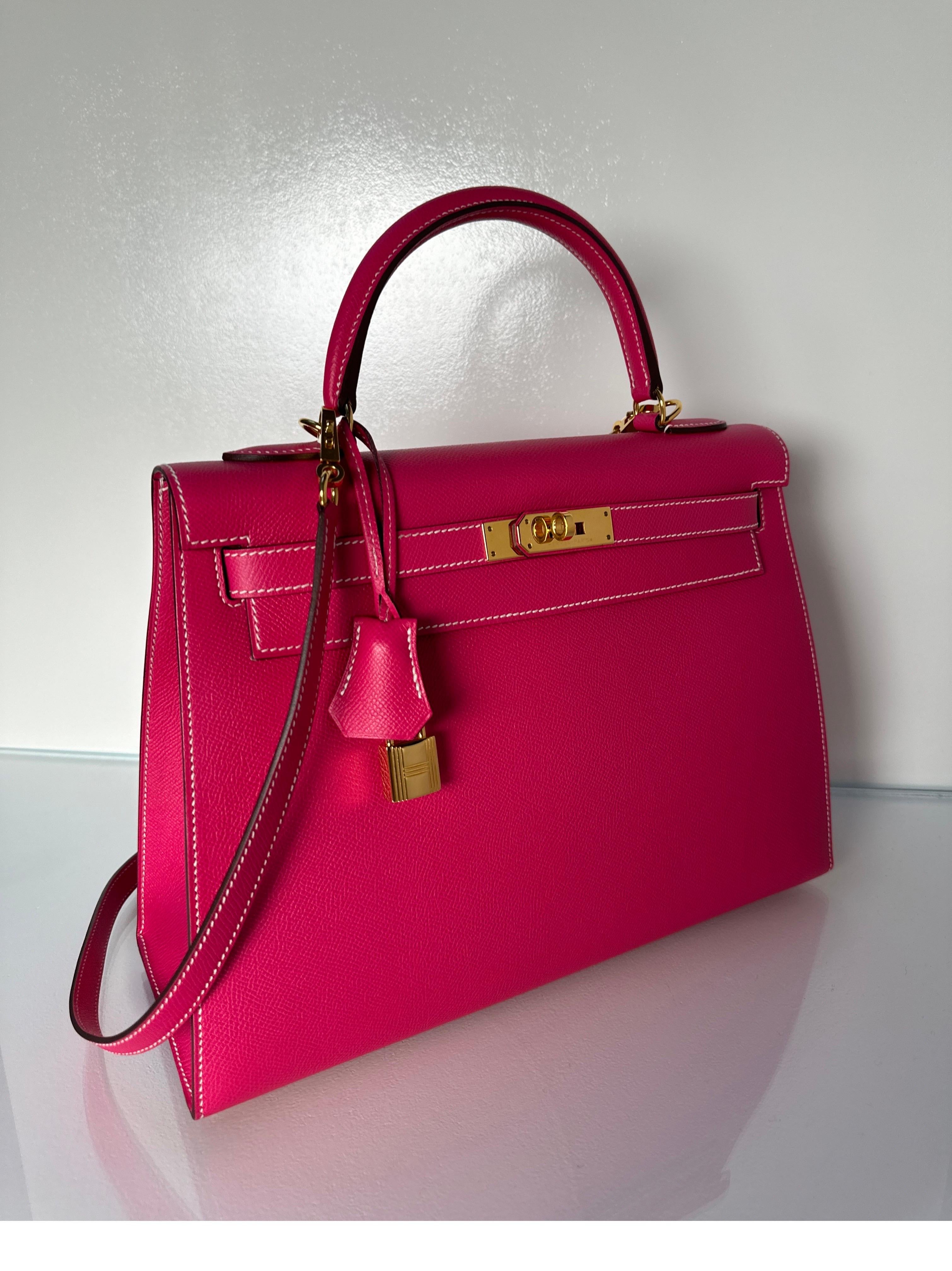 Hermes Rose Tyrien Kelly 32 Bag. Excellent condition. Sellier Kelly with contast white stitching. Beautiful hot pink color with rare gold hardware. Interior clean. Bag looks like new. Includes clochette, lock, keys, and dust bag. Guaranteed