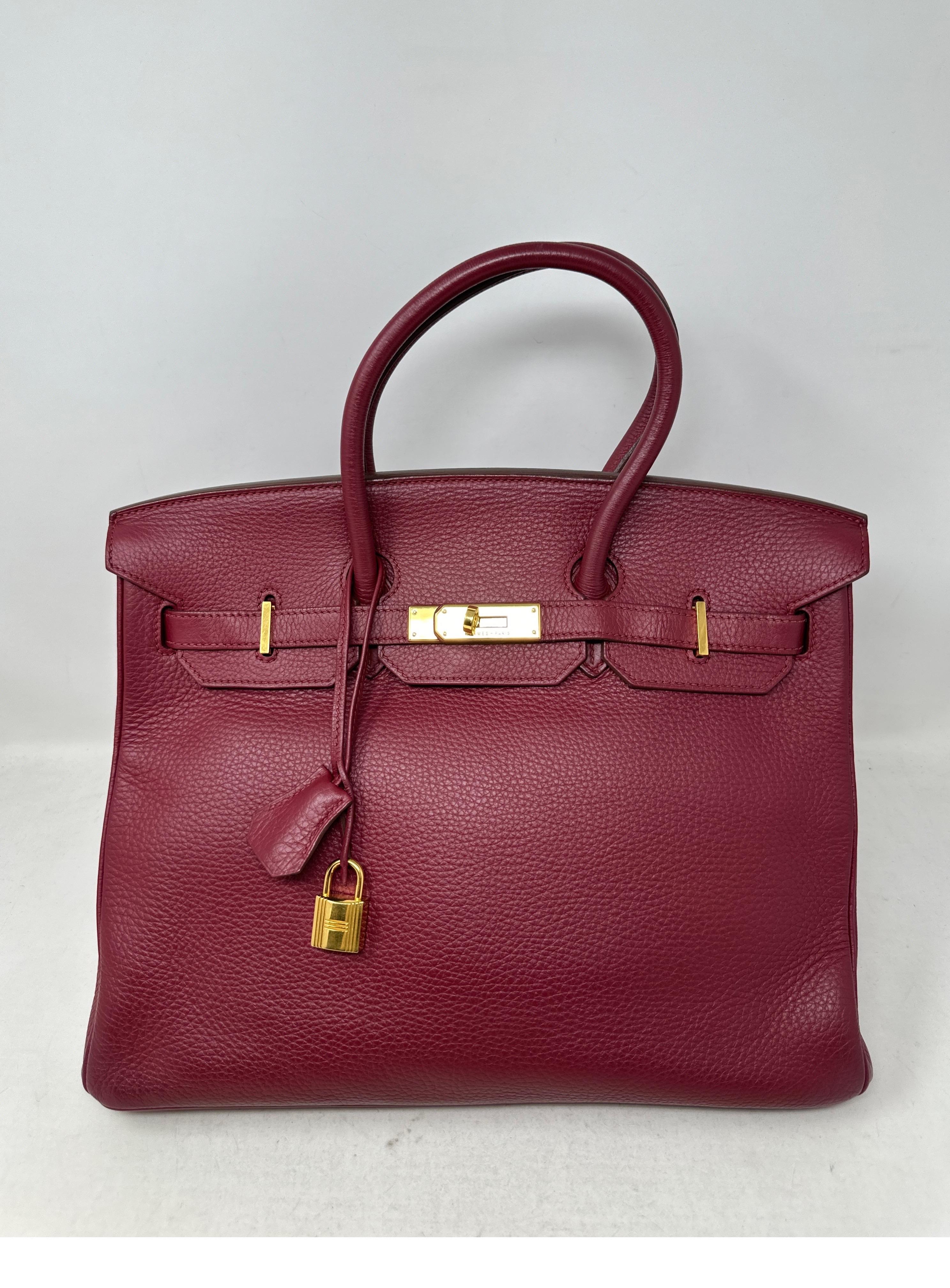 Hermes Rouge Birkin 35 Bag. Rich burgundy color leather with gold hardware. Interior clean. Includes clochette, lock, keys, and dust bag. Guaranteed authentic. 