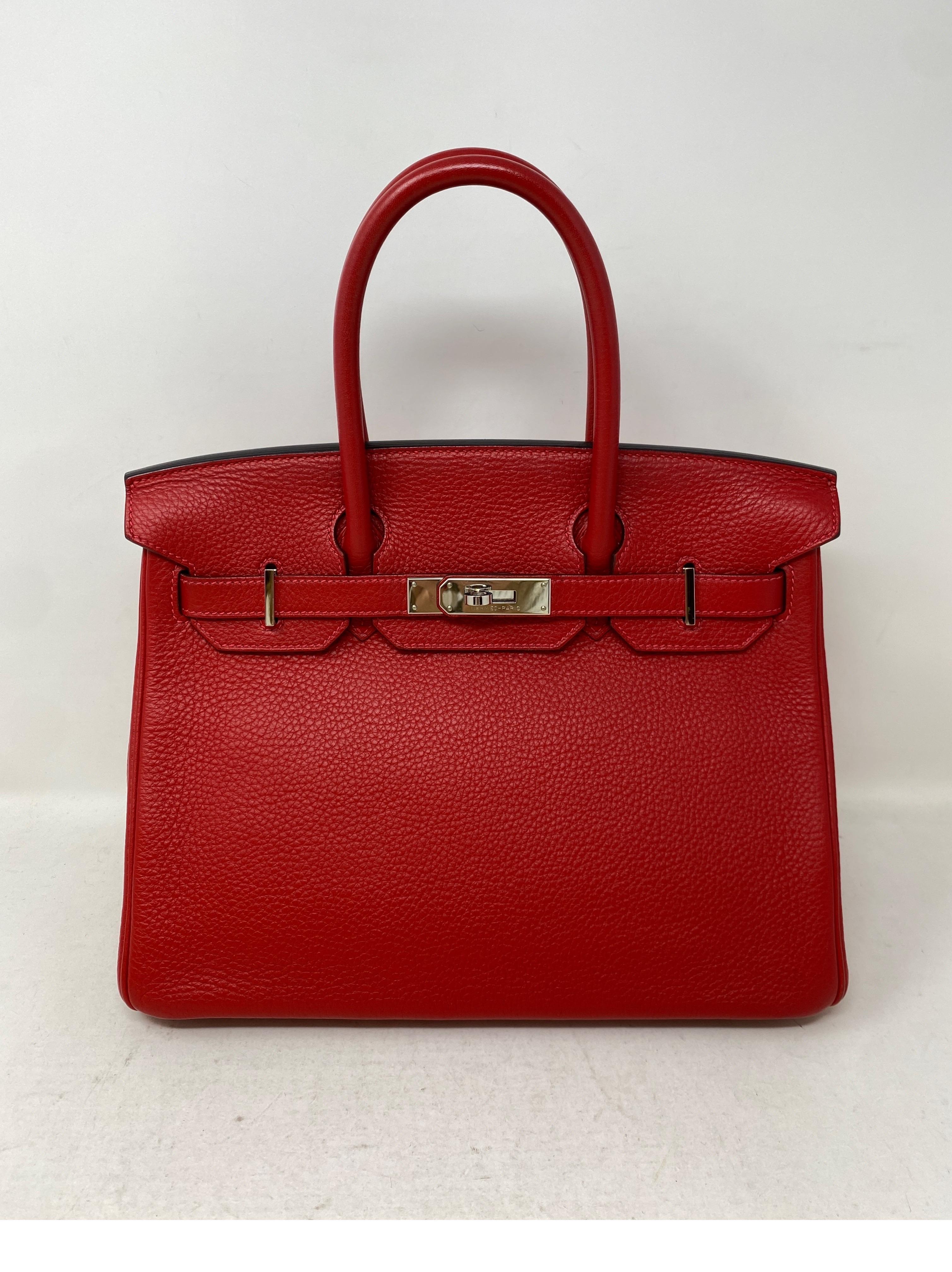 Hermes Rouge Casaque Birkin 30 Bag. Silver palladium hardware. Excellent condition. Interior clean. Beautiful vibrant red color. Most wanted rare size 30. Includes clochette, lock, keys, and dust bag. Guaranteed authentic. 