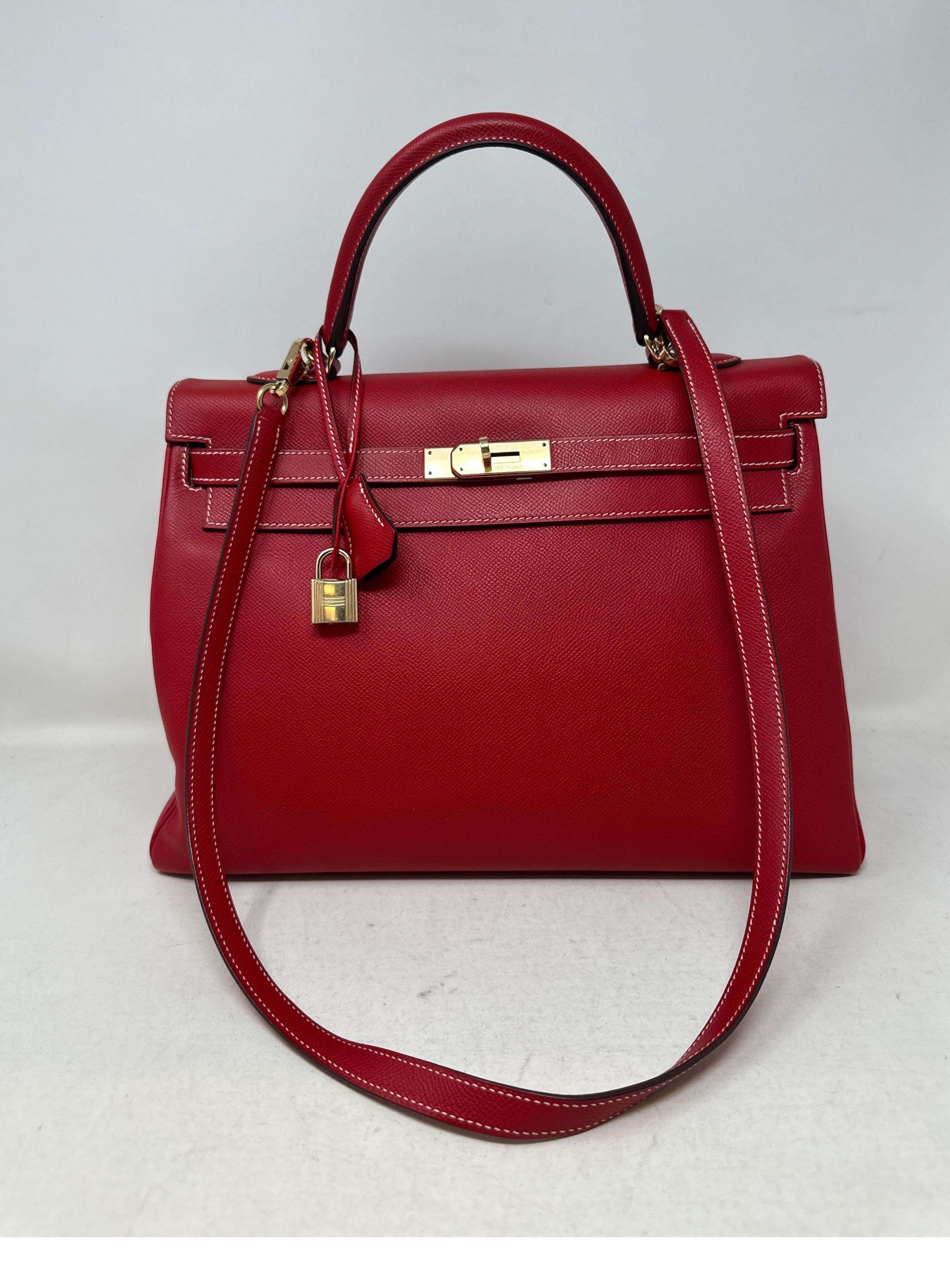 Hermes Rouge Casque Kelly 35 Bag. Candy interior with bue mykonos leather. Gold hardware. Excellent condition. Still has plastic on hardware. Priced to sell. Beautiful color red and rare blue interior. Kelly bags are hot right now. Includes