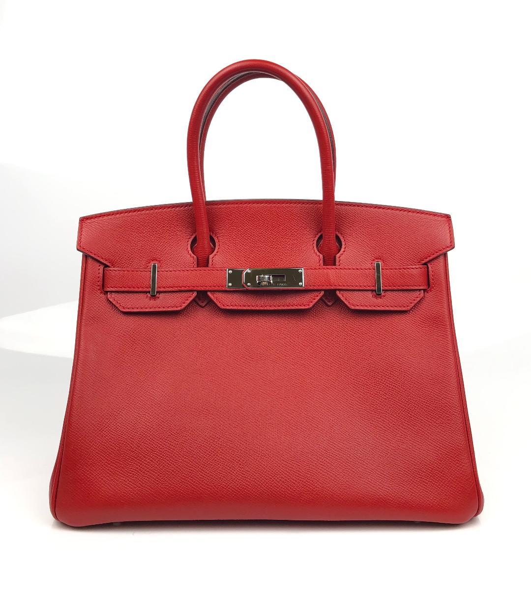 This authentic Hermès Rouge Casaque Epsom 30 cm Birkin is in pristine condition.    Considered the ultimate luxury item, the Hermès Birkin is stitched by hand. Long waitlists are commonplace.   Rouge Casaque is a beautiful red and perfectly accented