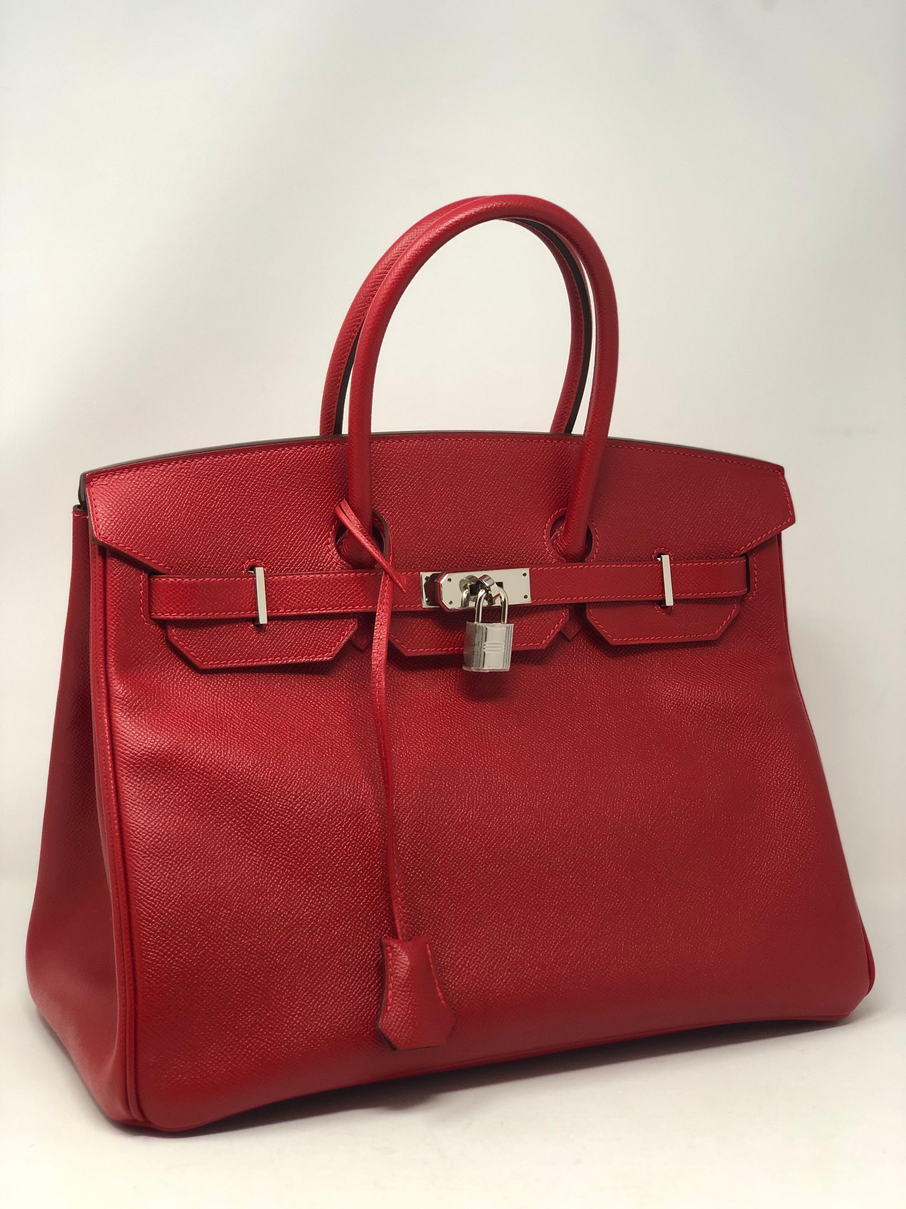 Hermes Rouge Casaque Birkin 35 Bag. Bright true red color in epsom leather. Palladium hardware. Excellent condition. Looks like new. Still has plastic on hardware. Hard red color to find. Includes clochette, lock, keys, and dust cover. Guaranteed