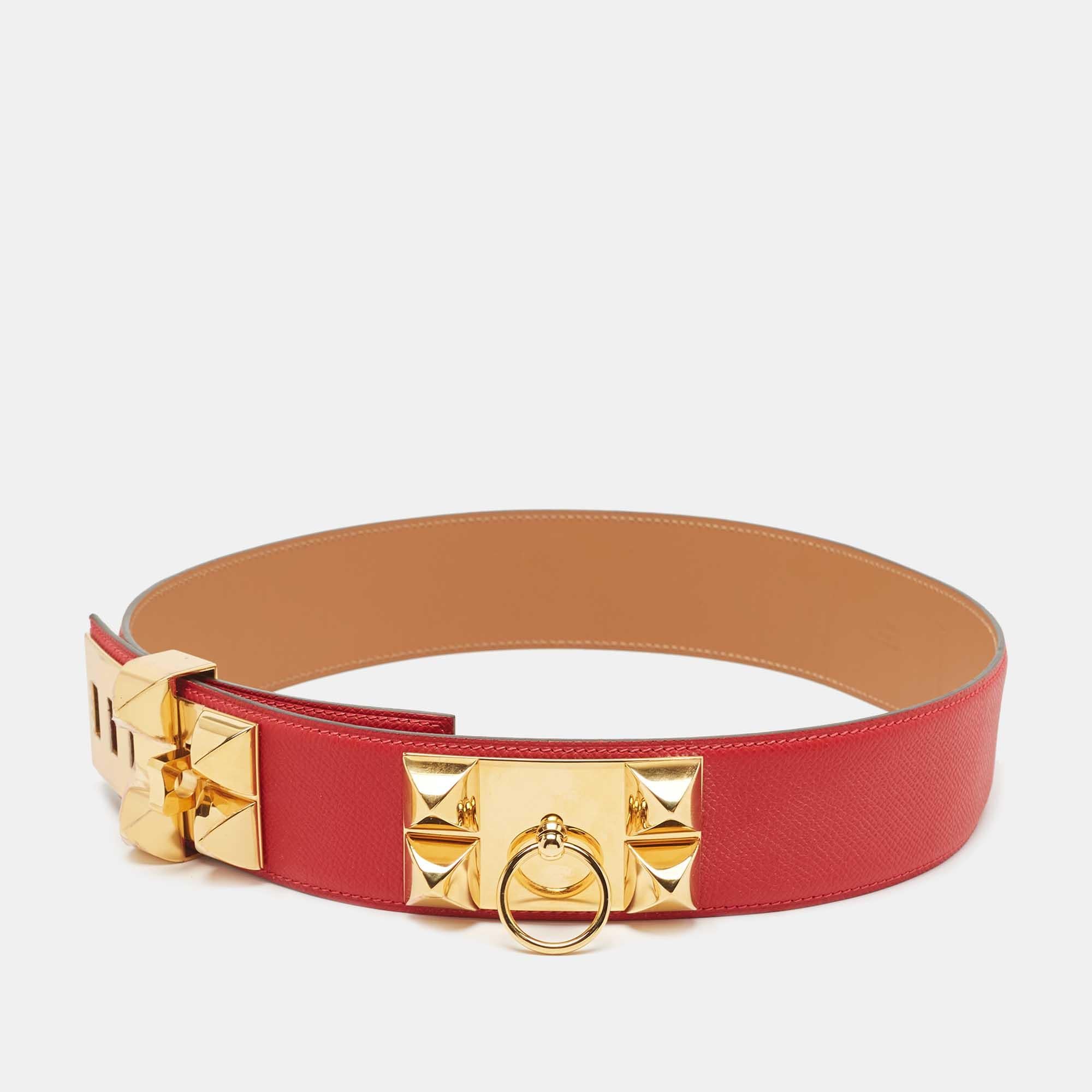 The Hermès Collier De Chien belt is a luxurious accessory characterized by its exquisite craftsmanship. Crafted from durable Epsom leather, it features iconic pyramid studs and a prominent buckle, delivering a blend of sophistication and edginess,