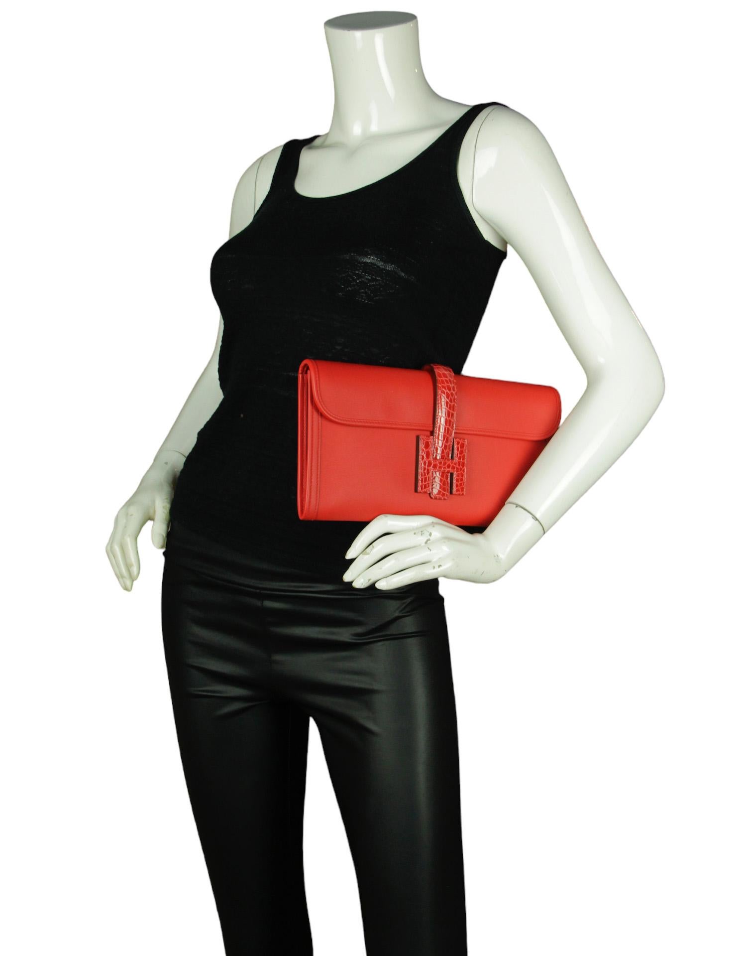 Hermes Rouge De Coeur Swift Leather & Alligator Jige Elan 29 Touch Clutch Bag

Made In: France
Year of Production: 2020
Color: Rouge de coeur red
Materials: Swift leather and Alligator Mississippiensis
Lining: Smooth leather
Closure/Opening: Flap