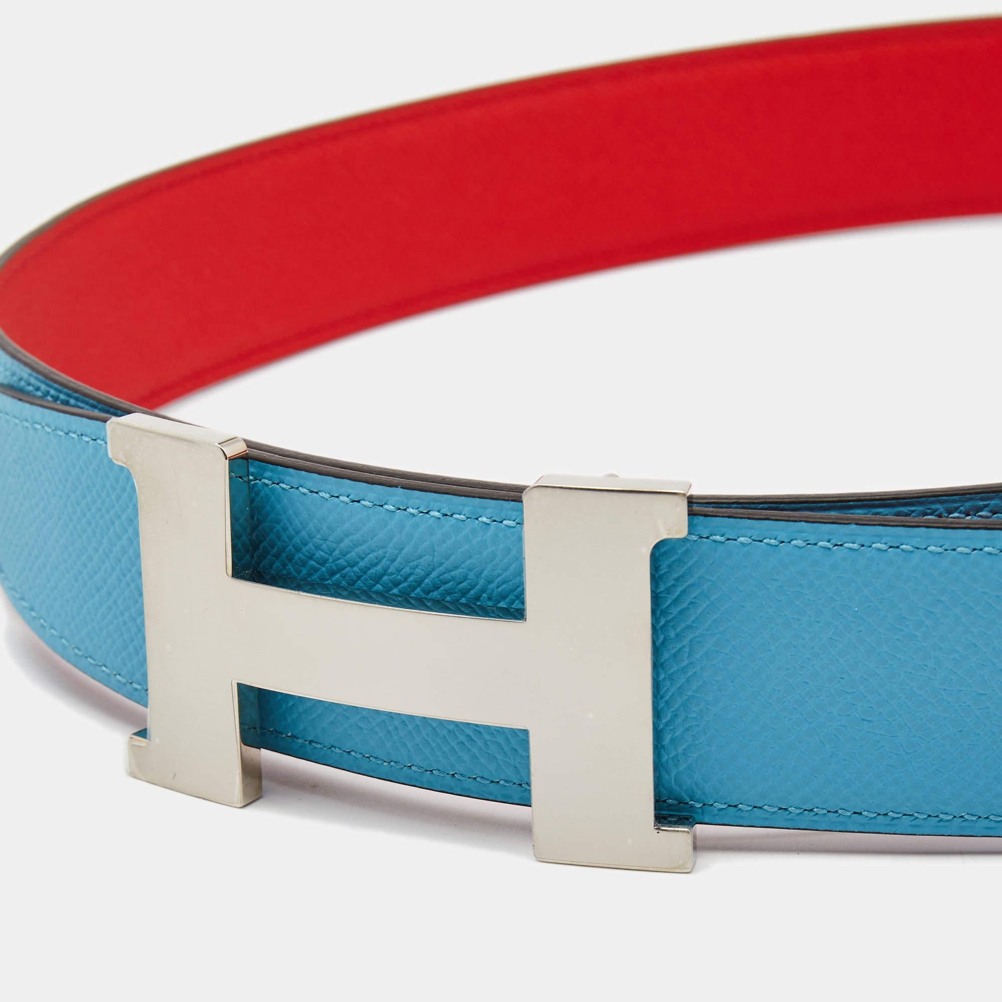A classic add-on to your collection of belts, this Hermes piece has been crafted from leather. It is reversible with a blue shade on one side and a classy shade on the other. It is topped with an H buckle in siver-tone. This wardrobe essential piece