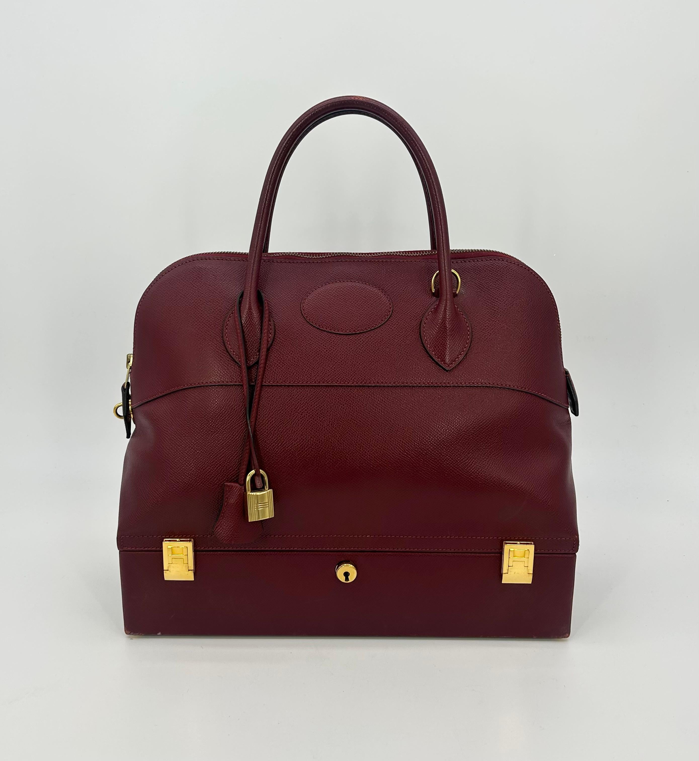 Hermes Rouge Epsom Leather Macpherson Bag c1990s in good condition. Rouge red epsom leather exterior trimmed with gold hardware. Top handle and removable shoulder strap easily converts between hand and shoulder styles to suit any occasion. Top zip