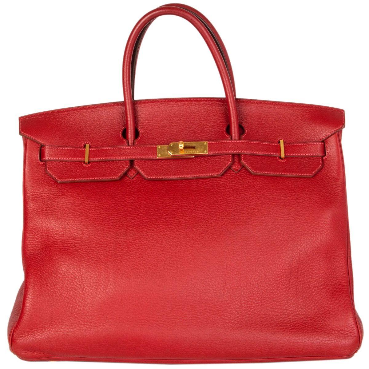 Hermes '40cm Birkin' in Rouge Garance Taurillon Clemence leather. Lined in Goatskin with an open pocket against the front and a zipper pocket against the back. Has been carried with some wear to the corners, the clochette and some light natural