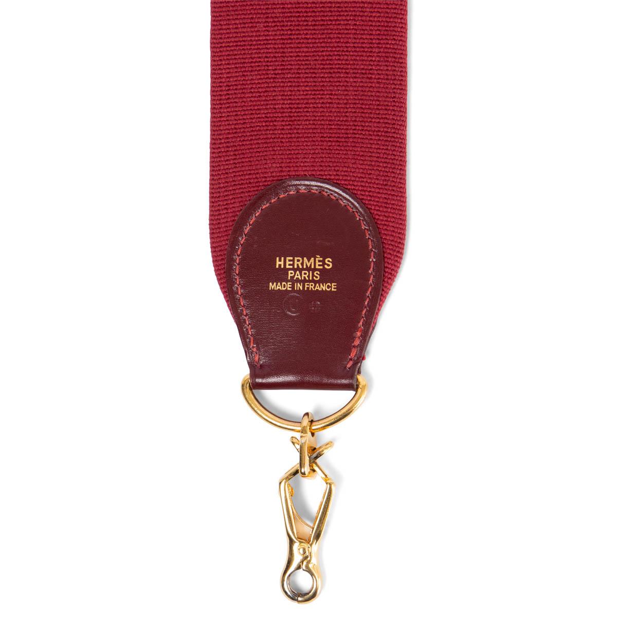 100% authentic Hermès shoulder strap for your Kelly or Evelyne bag in Rouge H canvas and Box leather. Has been carried and is in excellent condition.

Measurements
Width	5cm (2in)
Length	110cm (42.9in)
Hardware	Gold-Tone

All our listings include