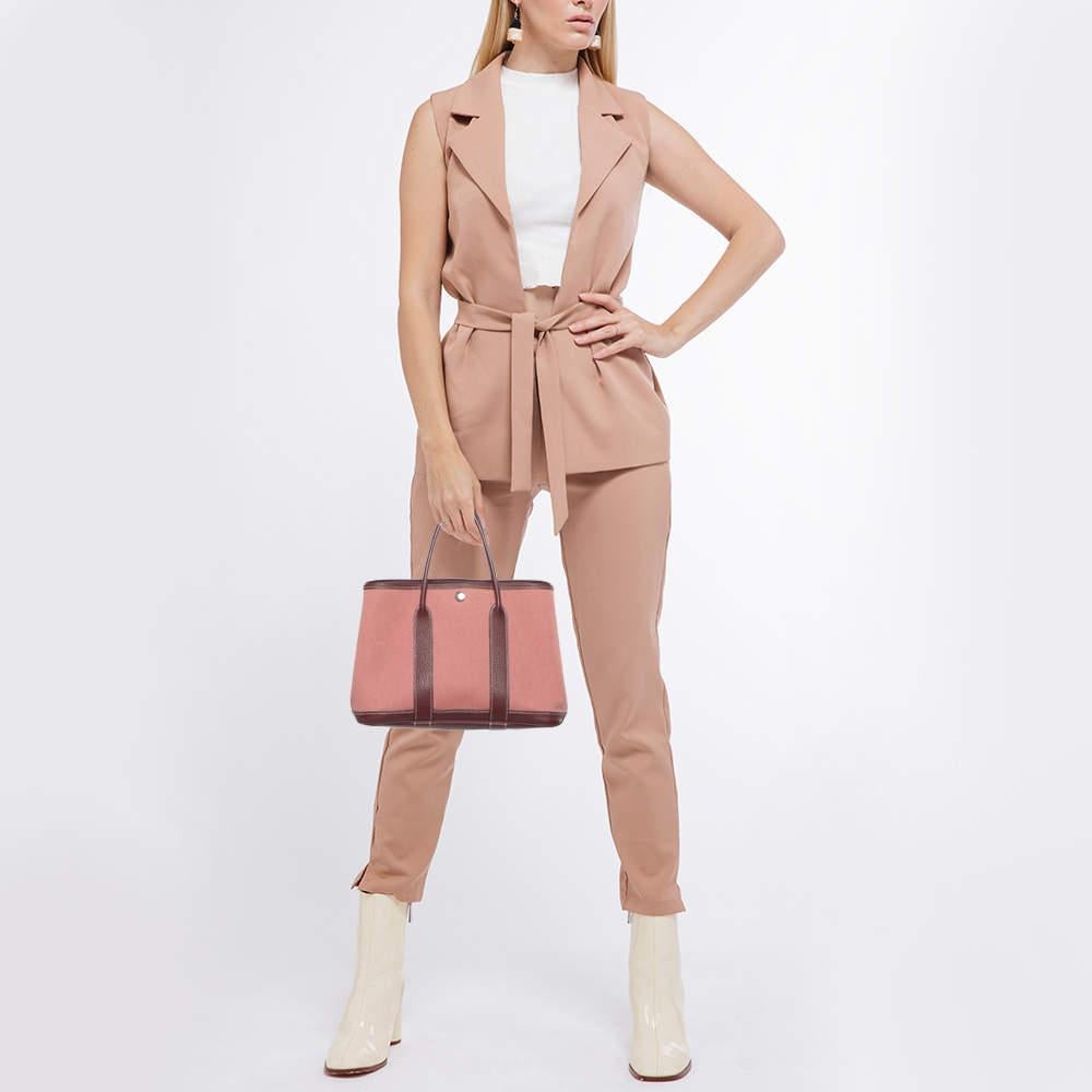 The Hermès Garden Party bag is a timeless and elegant accessory. Crafted from leather and canvas, it features clean lines and a spacious interior, making it both functional and stylish. With its dual leather handles and understated design, it