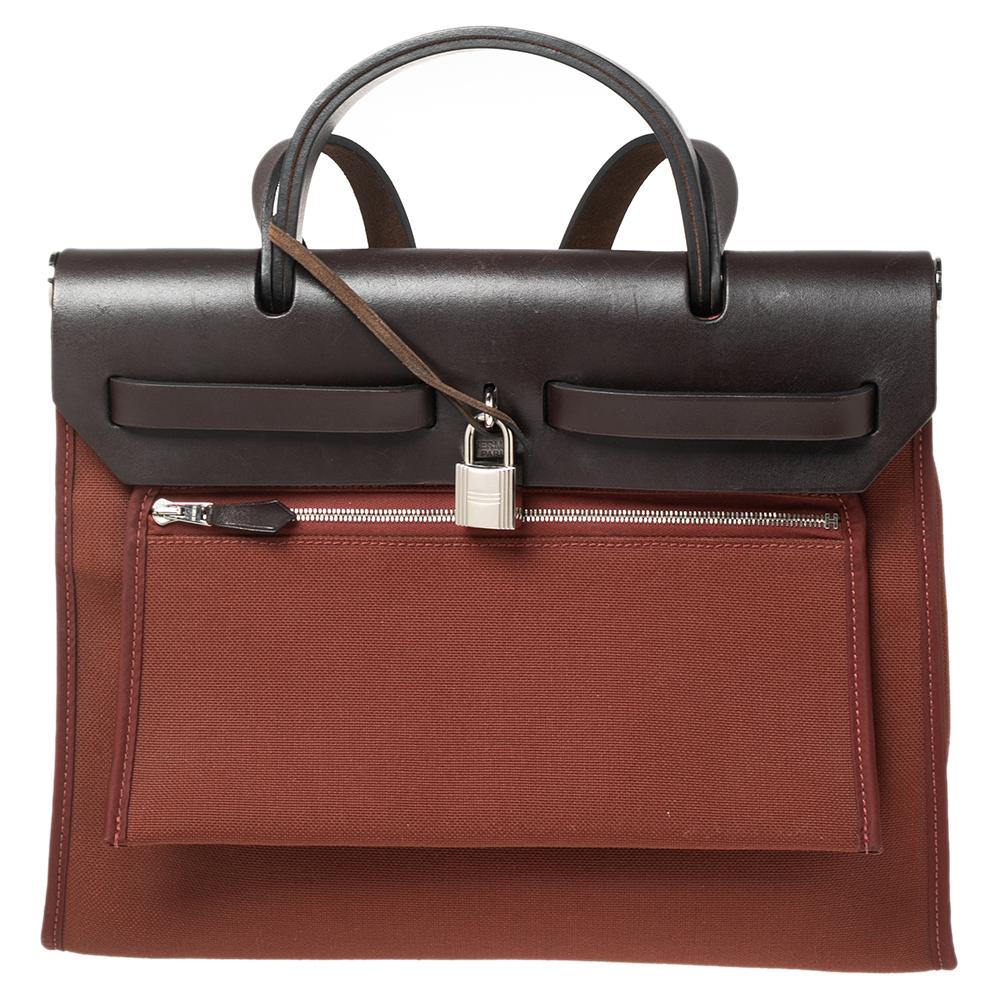 Made from canvas and leather, the Herbag Zip is just as outstanding as all of Hermes' other handbags. First introduced in 2009 as a new version of the Herbag, this piece comes with a single handle, a long shoulder strap and it flaunts a resemblance