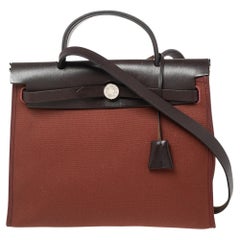Hermès - Sac Hermès Rouge H/Ebene en toile et cuir avec fermeture éclair 31