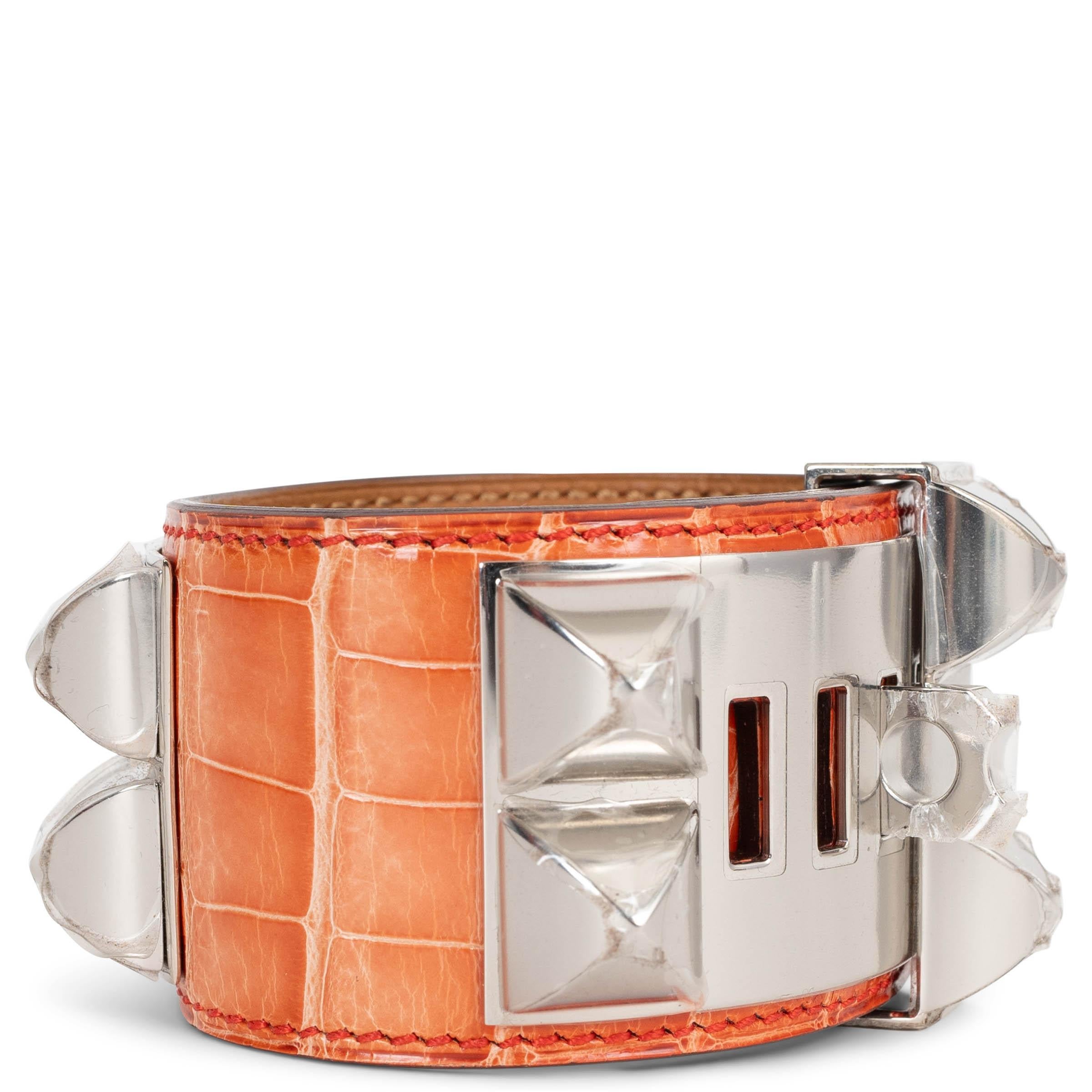 Hermes 'Collier de Chien' bracelet in Rouge Indien crocodile with Palladium hardware. Even though its never been worn, the sun has faded the color. Comes with box.

Size S
Width 4cm (1.6in)
Fits 17cm (6.6in) to 19cm (7.4in)
