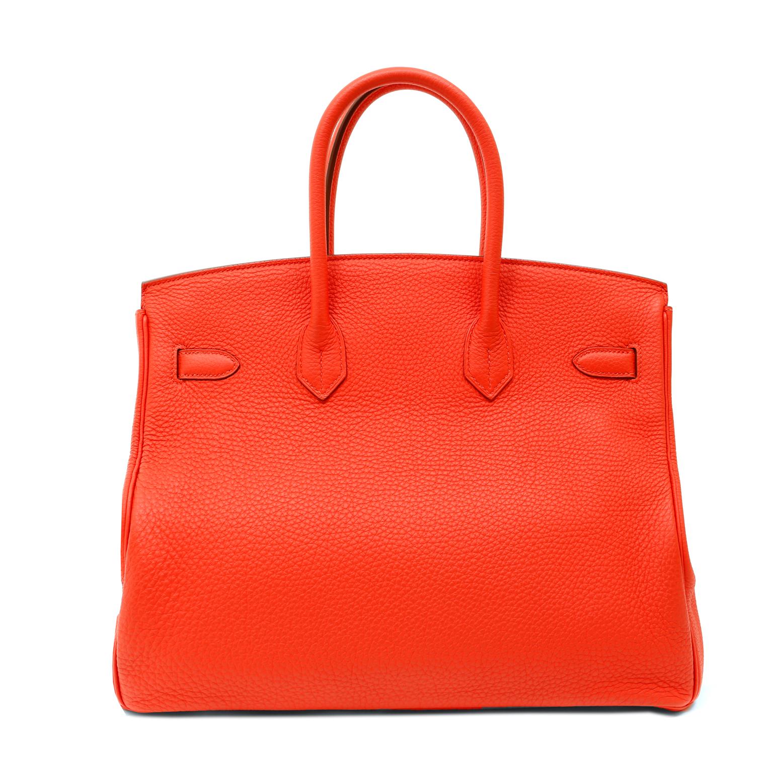 This authentic Hermès Rouge Jaipur Clemence 35cm Birkin is in excellent condition.  Hand stitched by skilled craftsmen, wait lists of a year or more are commonplace for the intensely coveted Hermès Birkin.  This brilliant bright cherry is a must