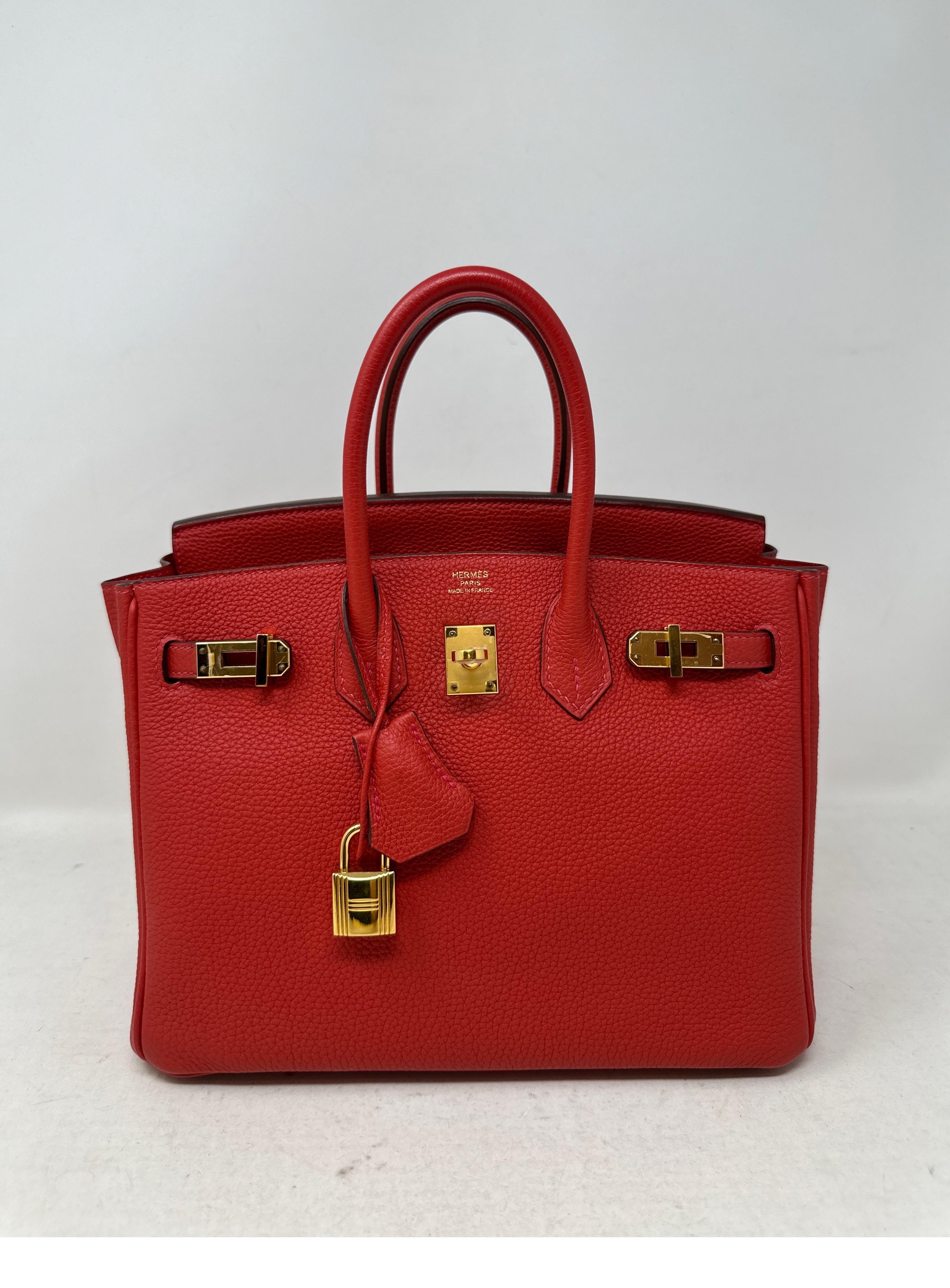 Hermes Rouge Pivoine Birkin 25 Bag. Beautiful red color with gold hardware. Togo leather. Looks like new condition. Excellent condition. Would make a perfect gift. Interior is mint. Plastic is still on the hardware. Full set includes clochette,