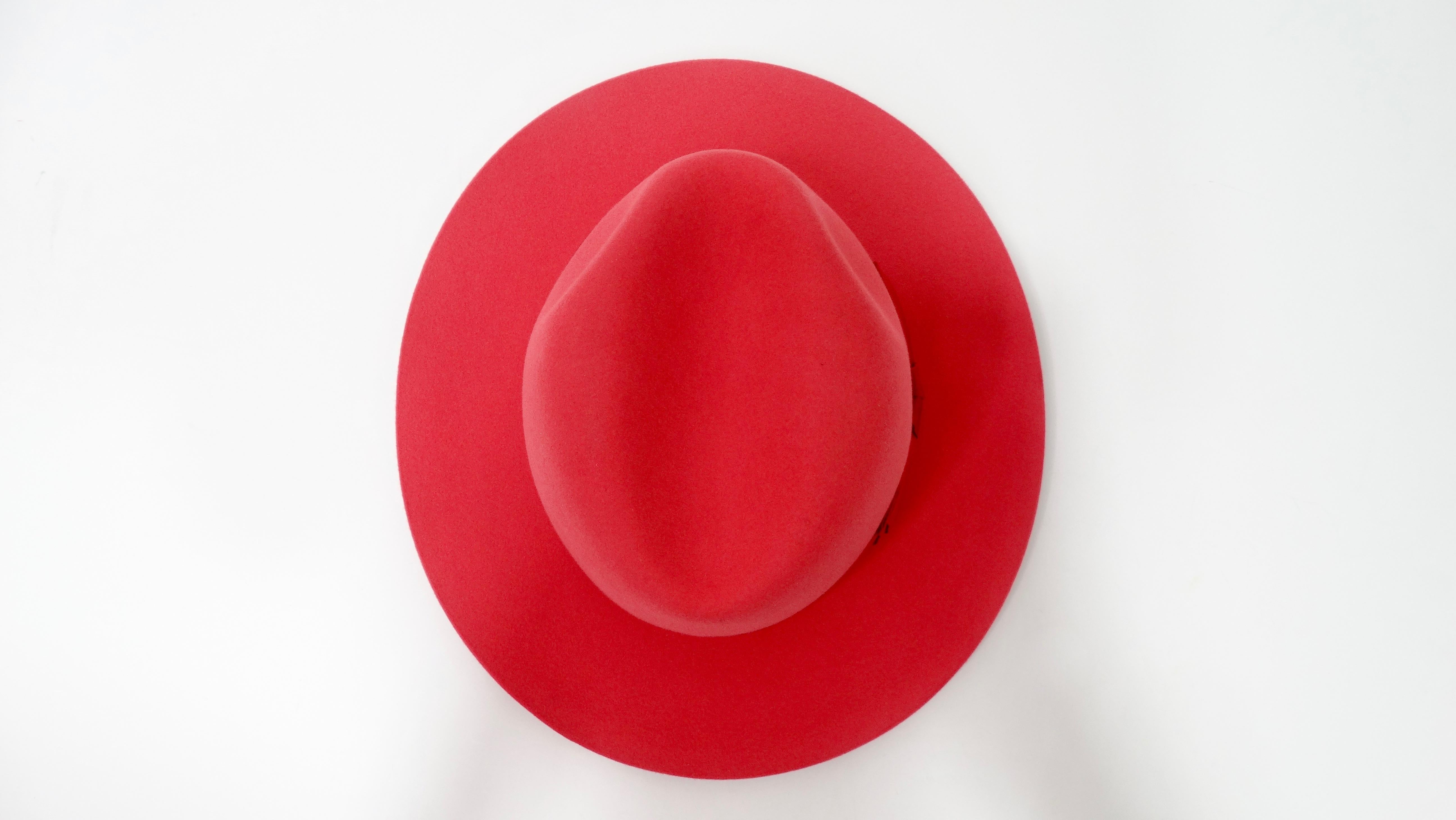 For the ultimate Hermés lover! Circa 21st century, this beautifully structured fedora is crafted from ultra soft rabbit felt with a rouge red finish. Around the base of the crown is a grosgrian rouge red ribbon. Interior is lined with an Hermés