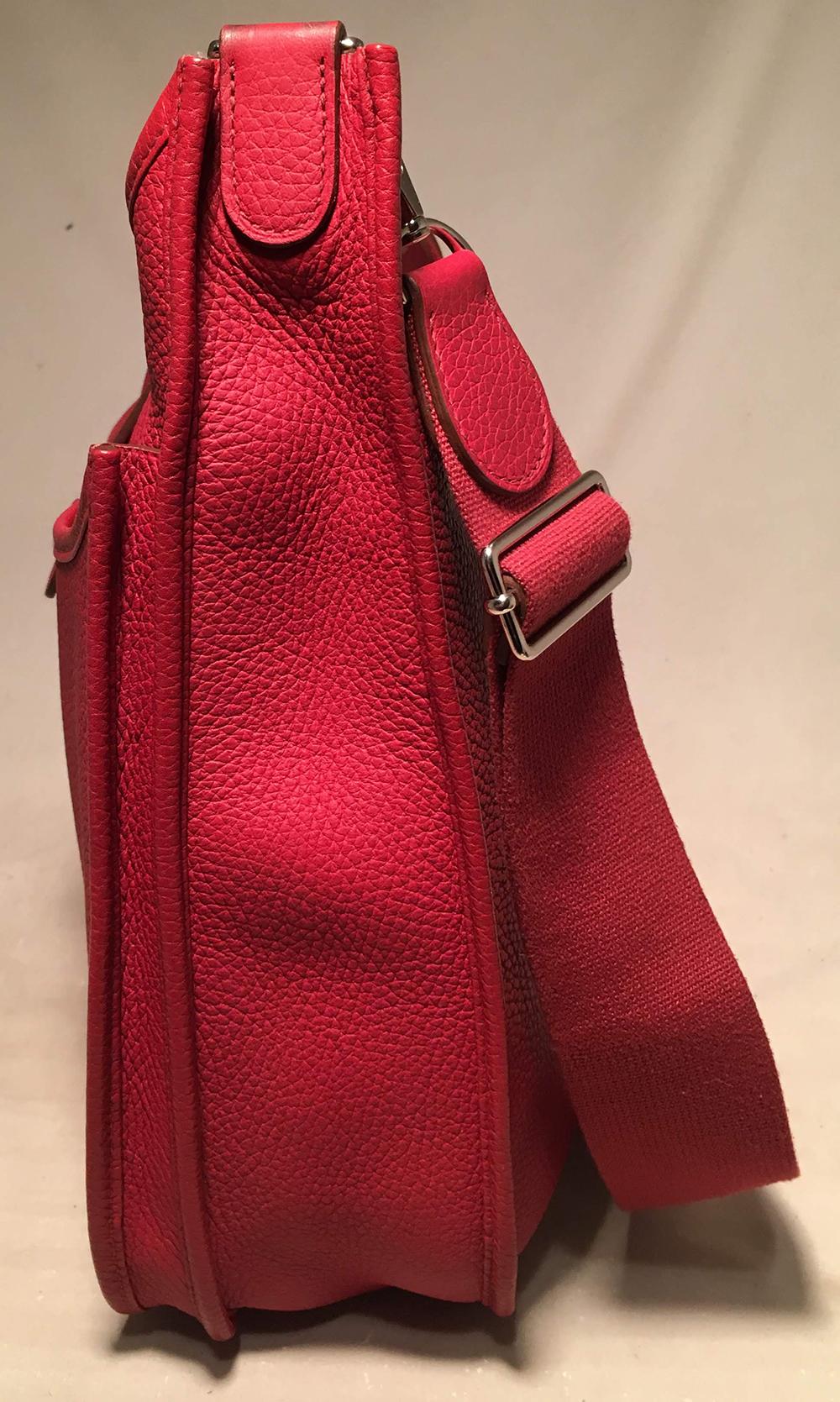 Hermes Rouge Red Togo Evelyne III GM 31cm Shoulder Bag in excellent condition. Rouge red togo leather exterior trimmed with silver palladium hardware. Back side gusset pocket. Top snap strap closure opens to a clean unlined interior. Matching rouge