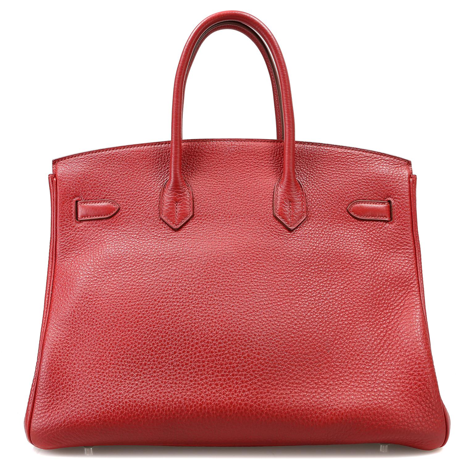 This authentic Hermès Rouge VIF Clemence 35 cm Birkin is in excellent condition.  Hermès bags are considered the ultimate luxury item the world over.  Hand stitched by skilled craftsmen, wait lists of a year or more are common.  Rouge VIF is a