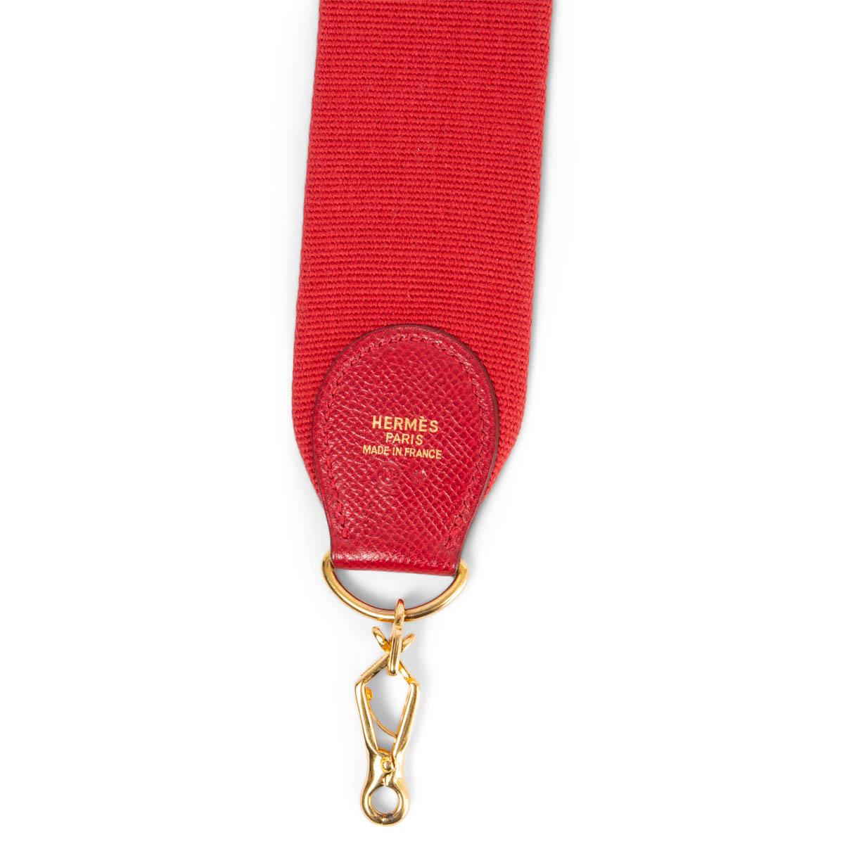 100% authentic Hermès shoulder strap for your Kelly or Evelyne bag in Rouge Vif canvas and Courchevel leather. Has been carried and is in excellent condition.

Measurements
Width	5cm (2in)
Length	110cm (42.9in)
Hardware	Gold-Tone

All our listings