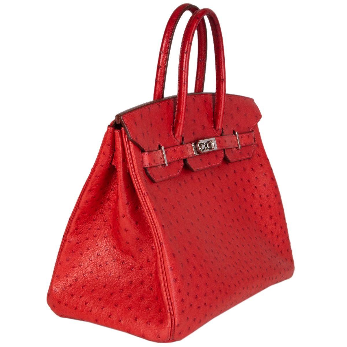 Hermès 'Birkin 35' bag in Rouge Vif ostrich leather. Lined in Chevre (goat skin) with an open pocket against the front and a zipper pocket against the back. Has been carried with slight darkening to the handles and bottom corners. Overall in
