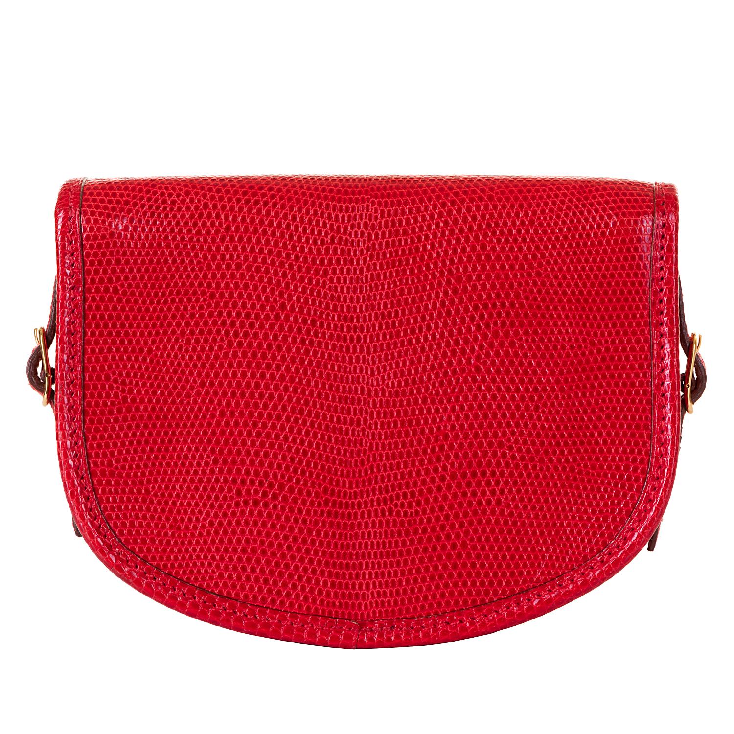 This beautiful, very rare vintage Hermes Mini evening bag, is finished in shiny red lizard, accented with gold hardware. In excellent condition throughout, this 'Tres-Chic bag can be worn as a clutch (as shown in the main image), or as a shoulder or