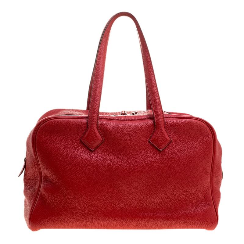 Bags as well-crafted as this one from Hermes don't cross our paths often because they are exclusive. The Victoria II comes wonderfully crafted from Togo leather and designed with double zippers that can be secured by a flip-lock. It carries an