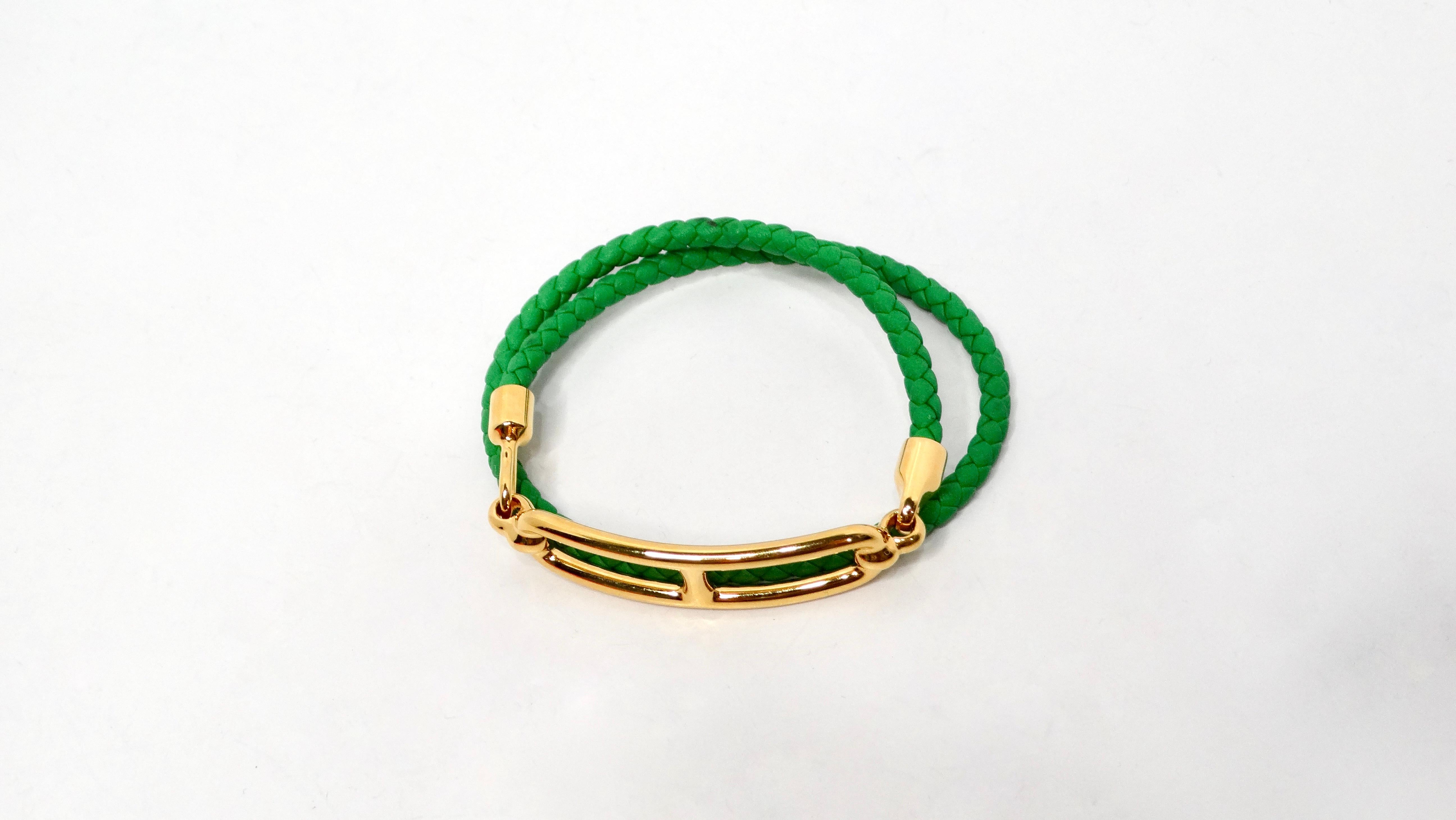 The Hermès Roulis Doble Tour Bracelet is an exquisite accessory that embodies the luxury and craftsmanship synonymous with the iconic French brand. Crafted from lush green leather, this bracelet features a braided wrap design that adds a unique