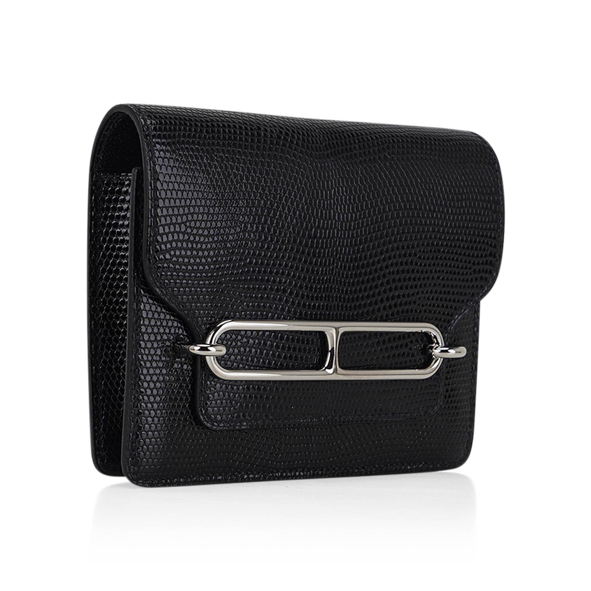 Mightychic offers an Hermes Roulis Slim Wallet Belt bag featured in Black Lizard.
Sleek and crisp with Palladium hardware.
Includes removable zipped change purse and 2 credit card slots.
Fits up to a 42mm Hermes Belt.
Comes with sleeper and