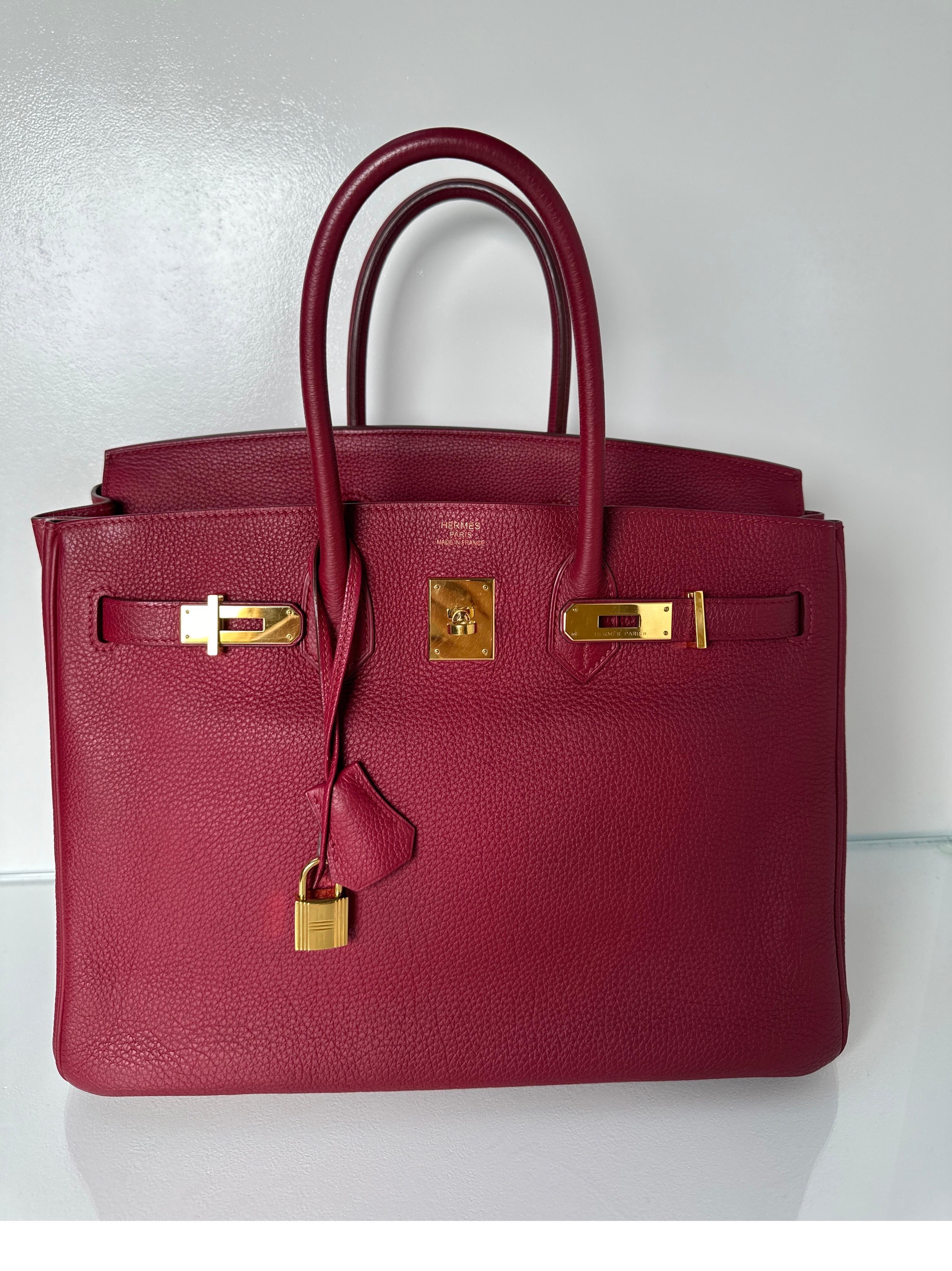 Hermes Rubis Birkin 35 Bag. Excellent condition. Togo leather. Burgundy red color bag with gold hardware. Interior clean. Bag looks unused. Beautiful color. Includes clochette, lock, keys, and dust bag. Full set with box. Guaranteed authentic. 