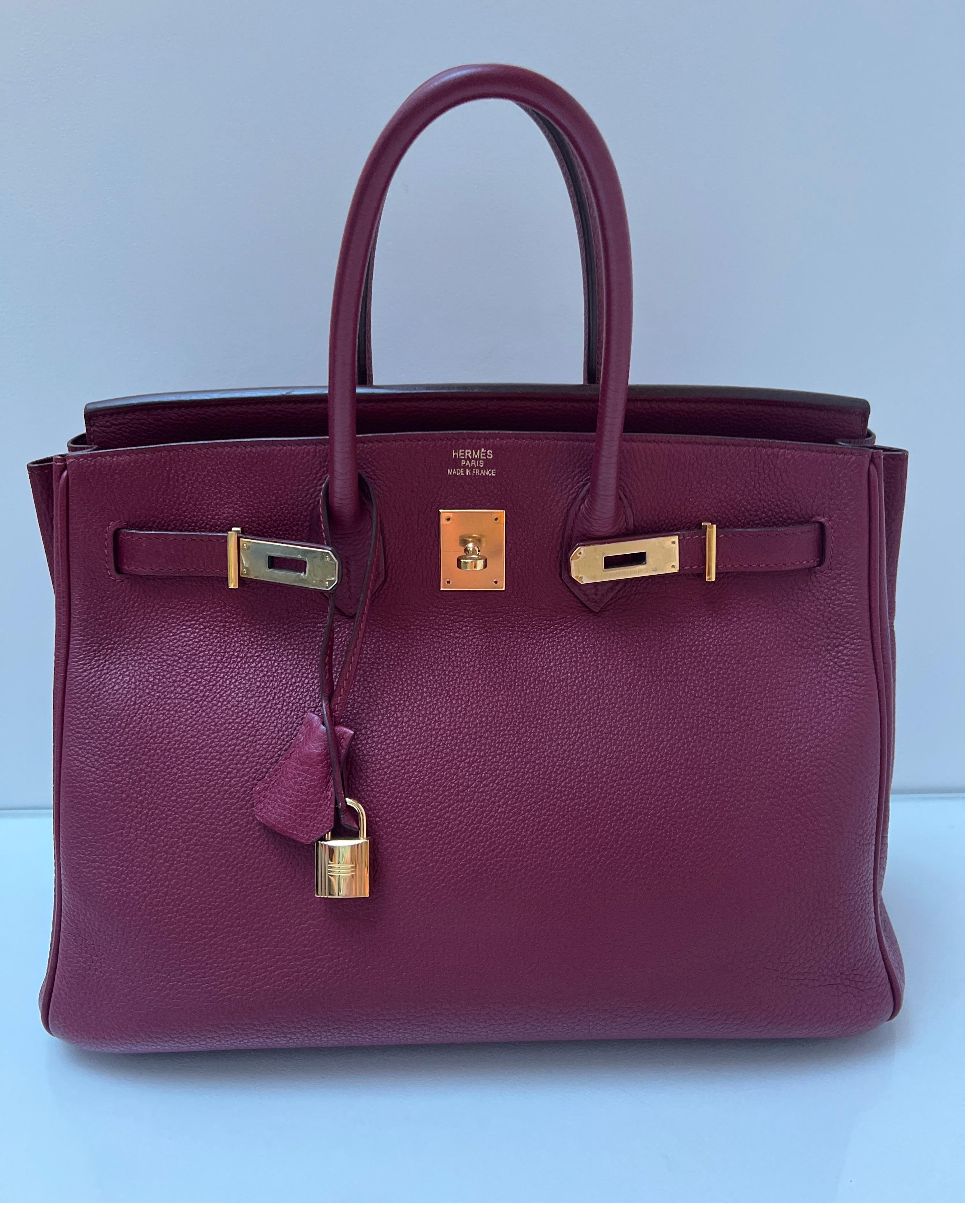 Hermes Rubis Birkin 35 Bag. Beautiful deep burgundy red color. Called Rubis and togo leather. Gold hardware. Bag is in very good condition. Plastic is still on hardware. This is the most wanted color of the season. Amazing bag at a great price.